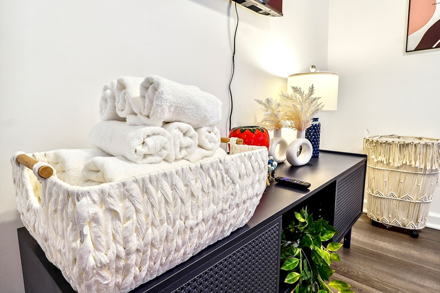 Bedroom 2 is located upstairs and features two king beds and a TV. This room does not have a private en-suite bathroom but has access to a shared full bathroom on the second floor.