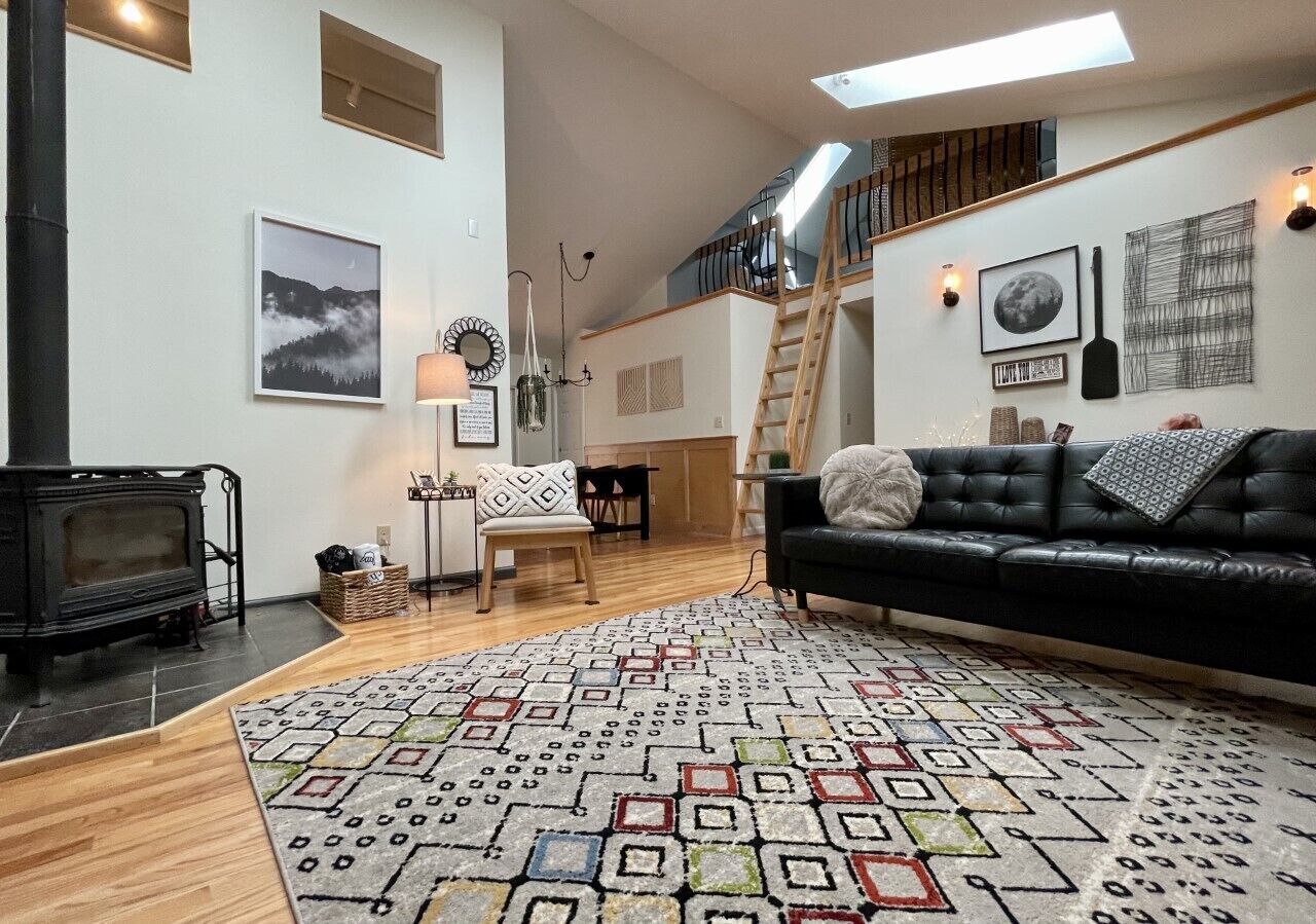 Looking towards the hall with three bedrooms below loft area