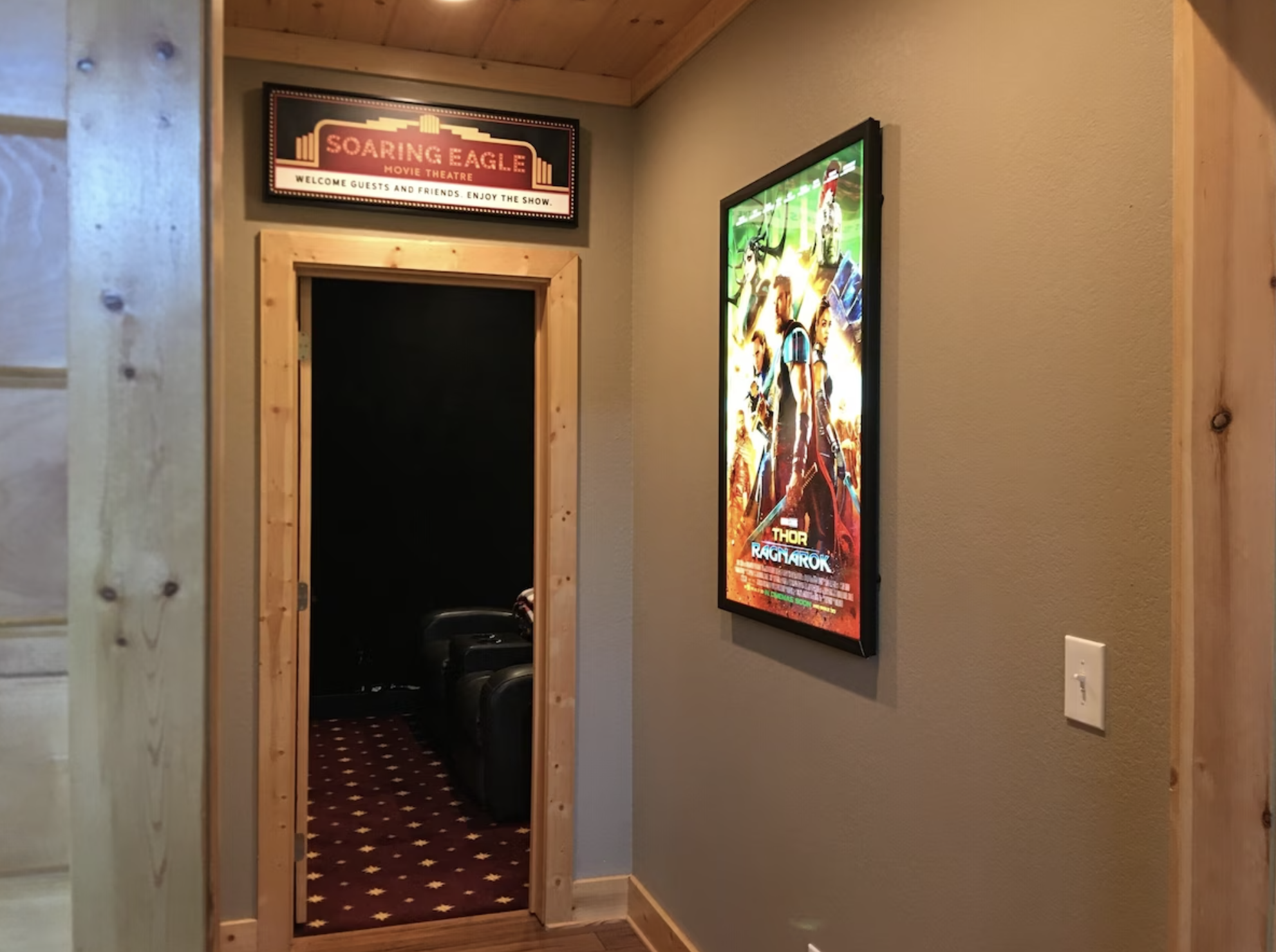 The entry to the Soaring Eagle Chalet Movie Theater, fit with a backlit movie poster!