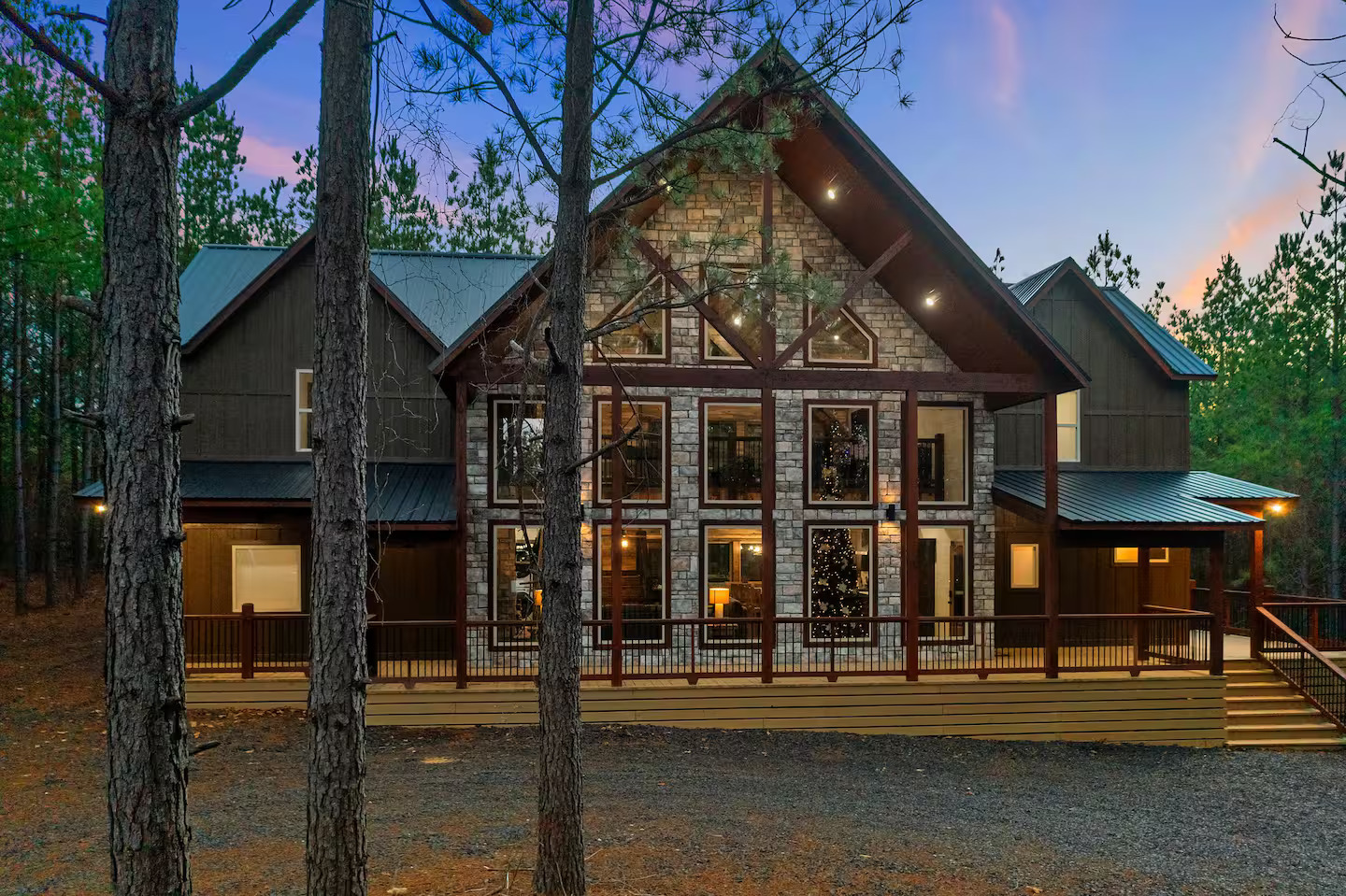 Luxury meets wilderness in this spacious outdoor setting — comfortable furnishings, a cozy fireplace, and nature as your backdrop.