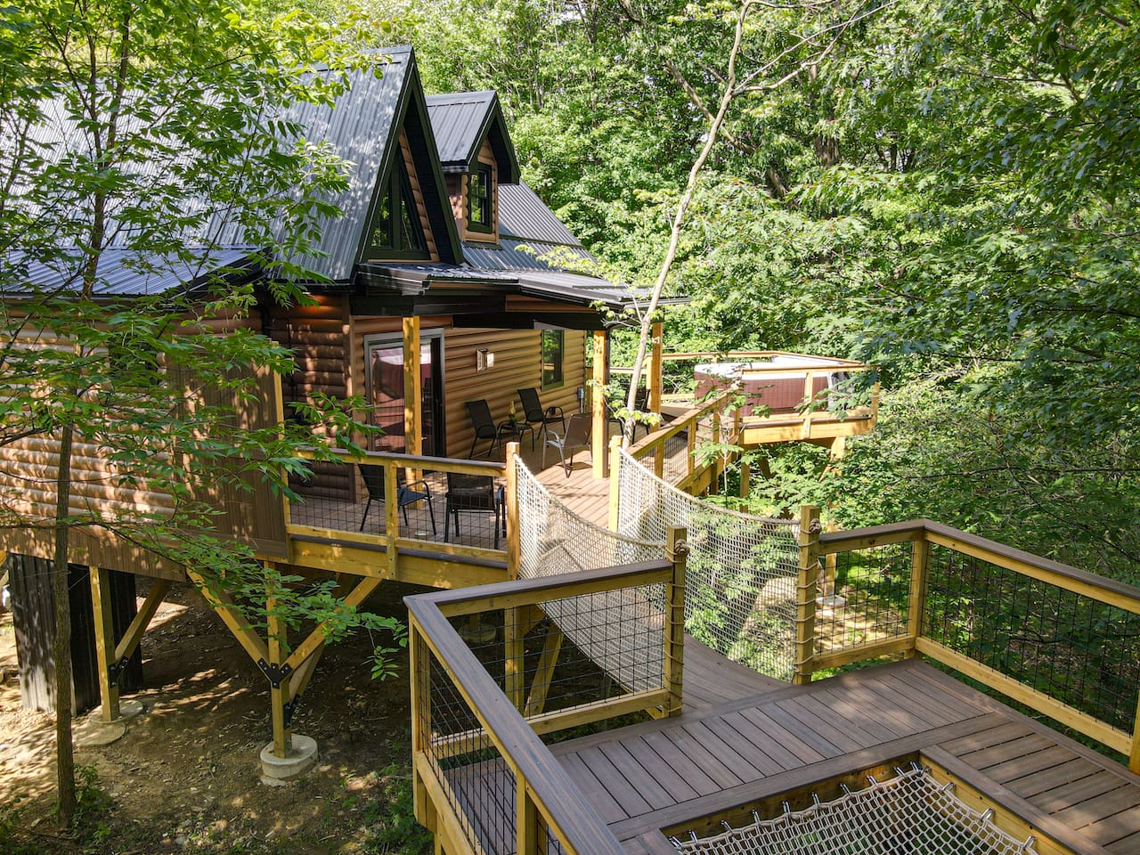 The perfect blend of comfort and nature. Take some time to sit back and relax. Enjoy the elevated hot tub and refreshing outdoor shower. The hammock built into the deck floor provides a unique experience to help you unwind amongst the trees