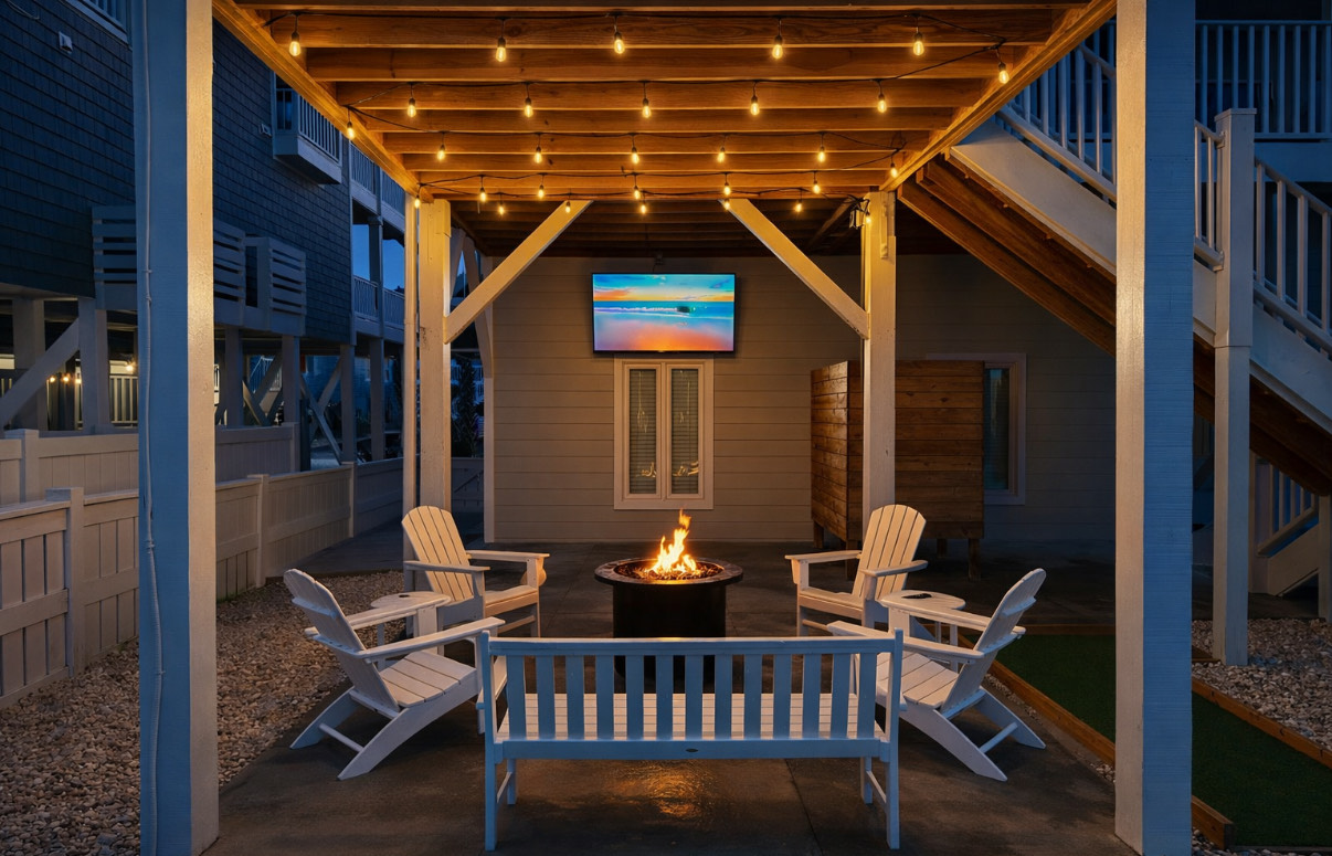 Backyard fire pit with TV. Perfect spot to unwind.