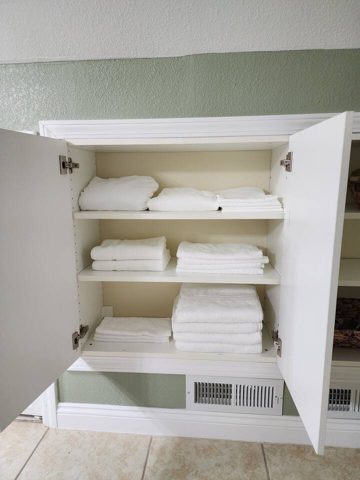 Upstairs bathroom linen cabinet includes everything you will need for your stay. Bathmats, bath towels, hand towels, wash rags, extra sheets & pillow cases.