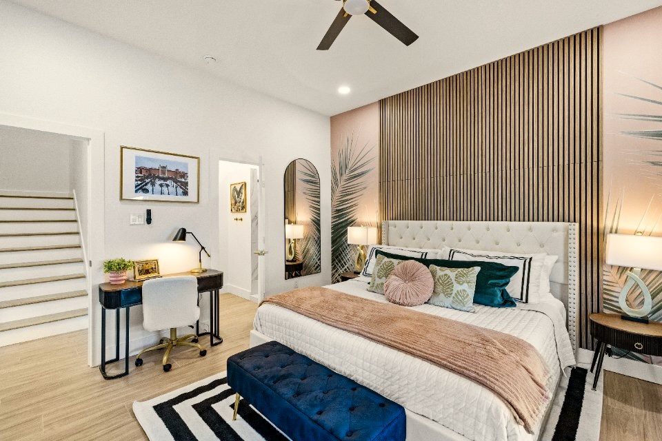 Enjoy luxurious bedding in the Palms of the Grand Galvez themed Primary Suite.