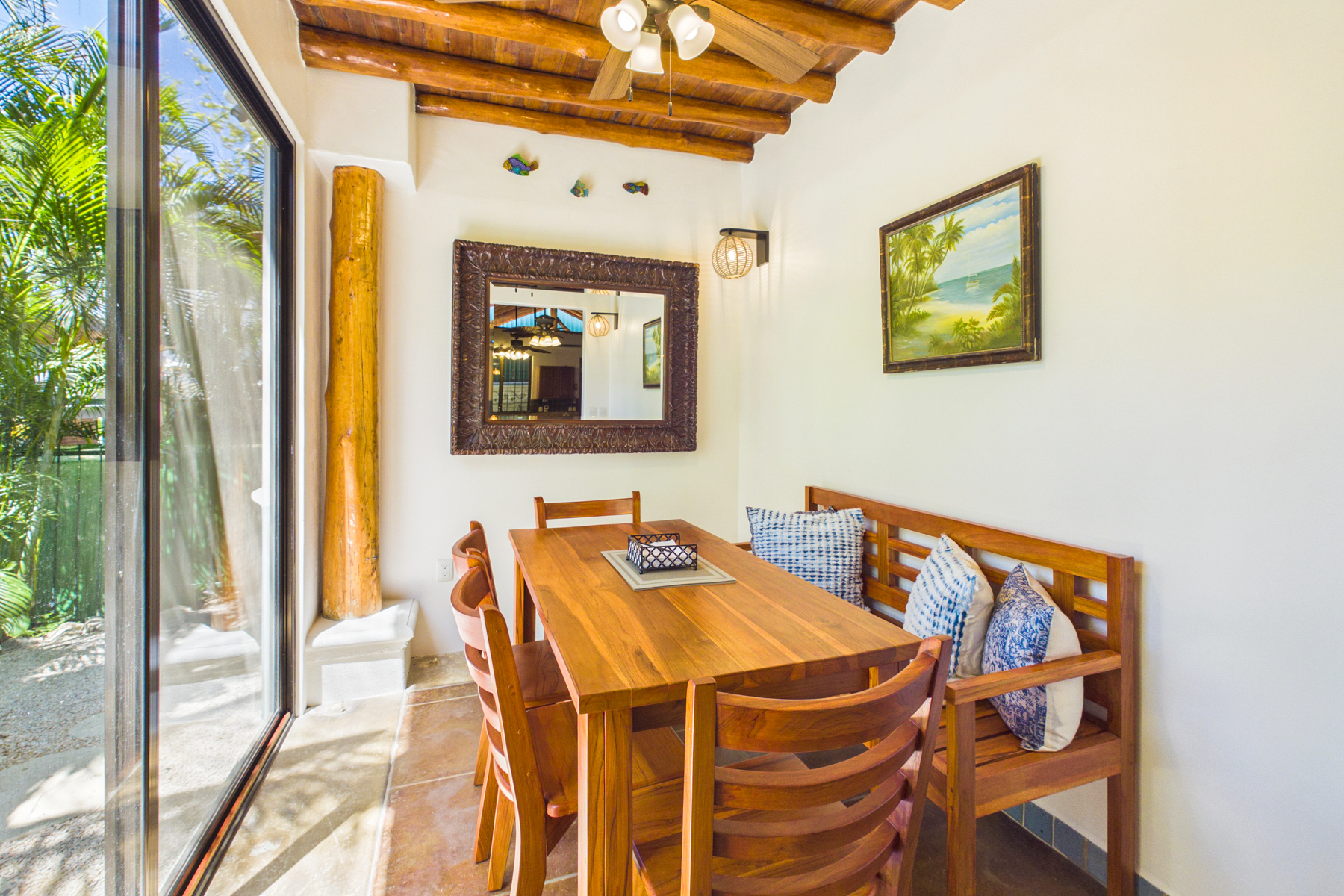 Indoor dining room.  Custom locally made indoor dining table offers seating for 6 people in addition to kitchen island seating for 3.  Sliding patio doors from dining room lead to beautifully, mature landscaped front yard
