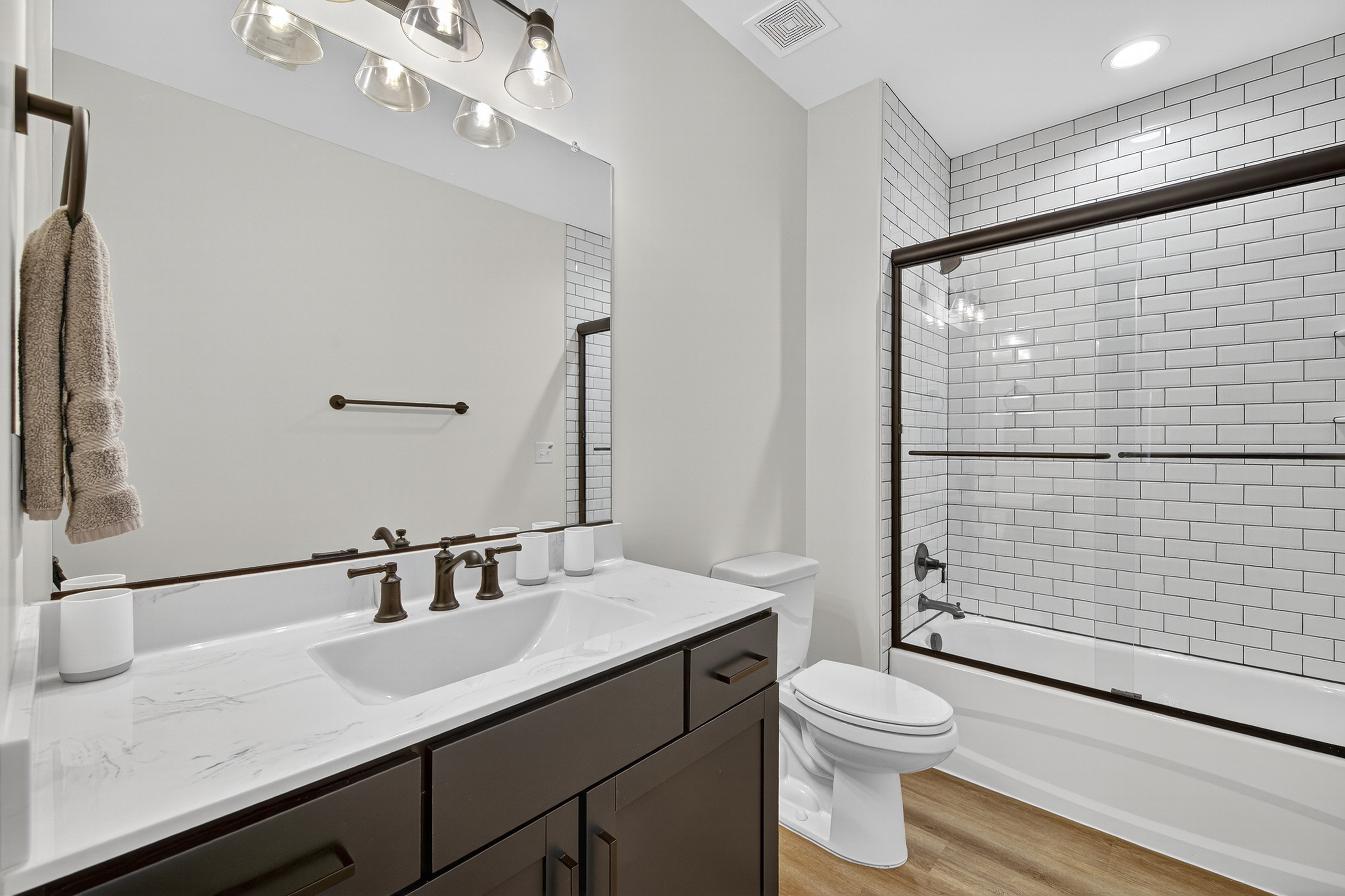 Sleek design meets everyday comfort in this stylish full bath.