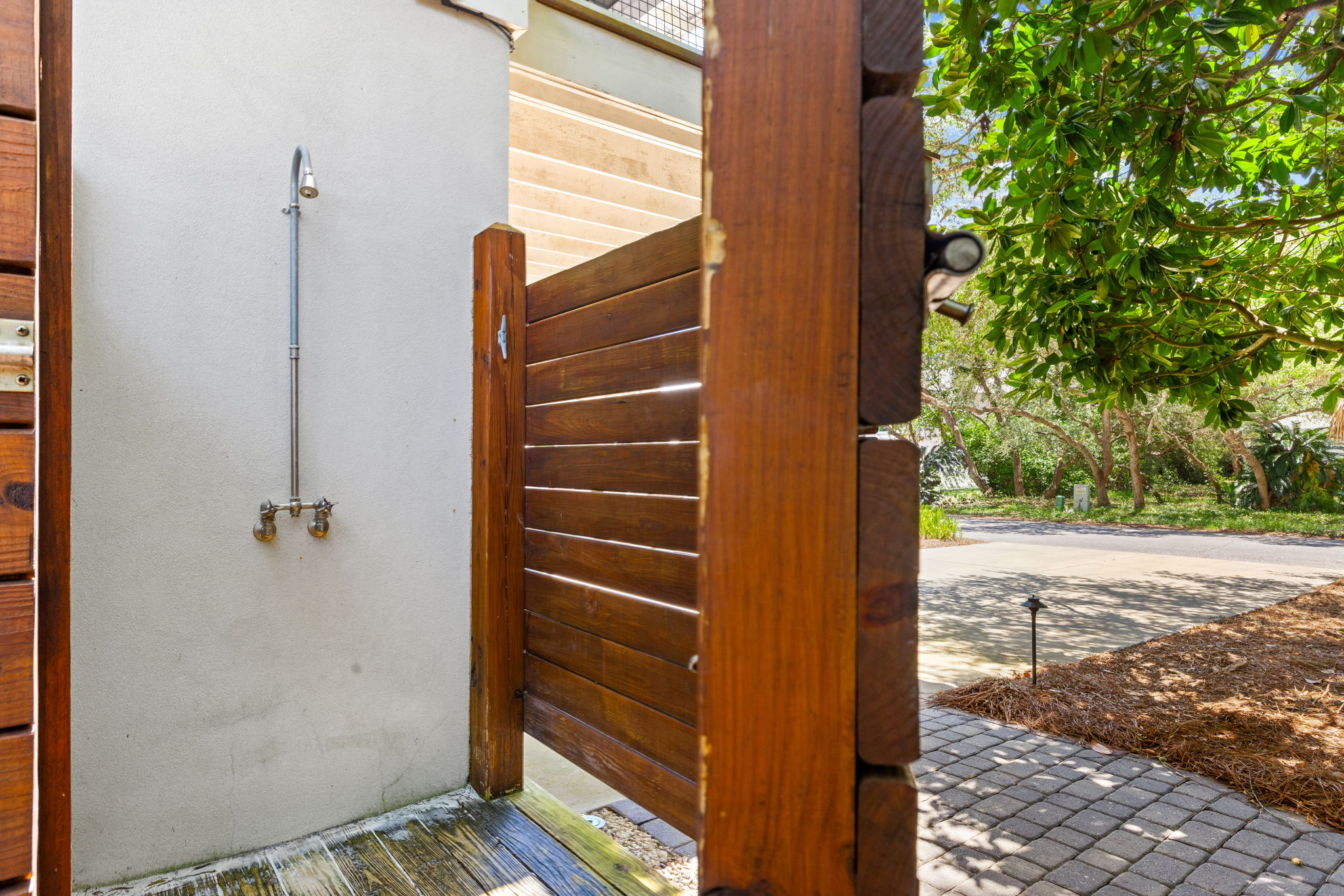 The ultimate beachside convenience—rinse off the sand and saltwater before heading inside.