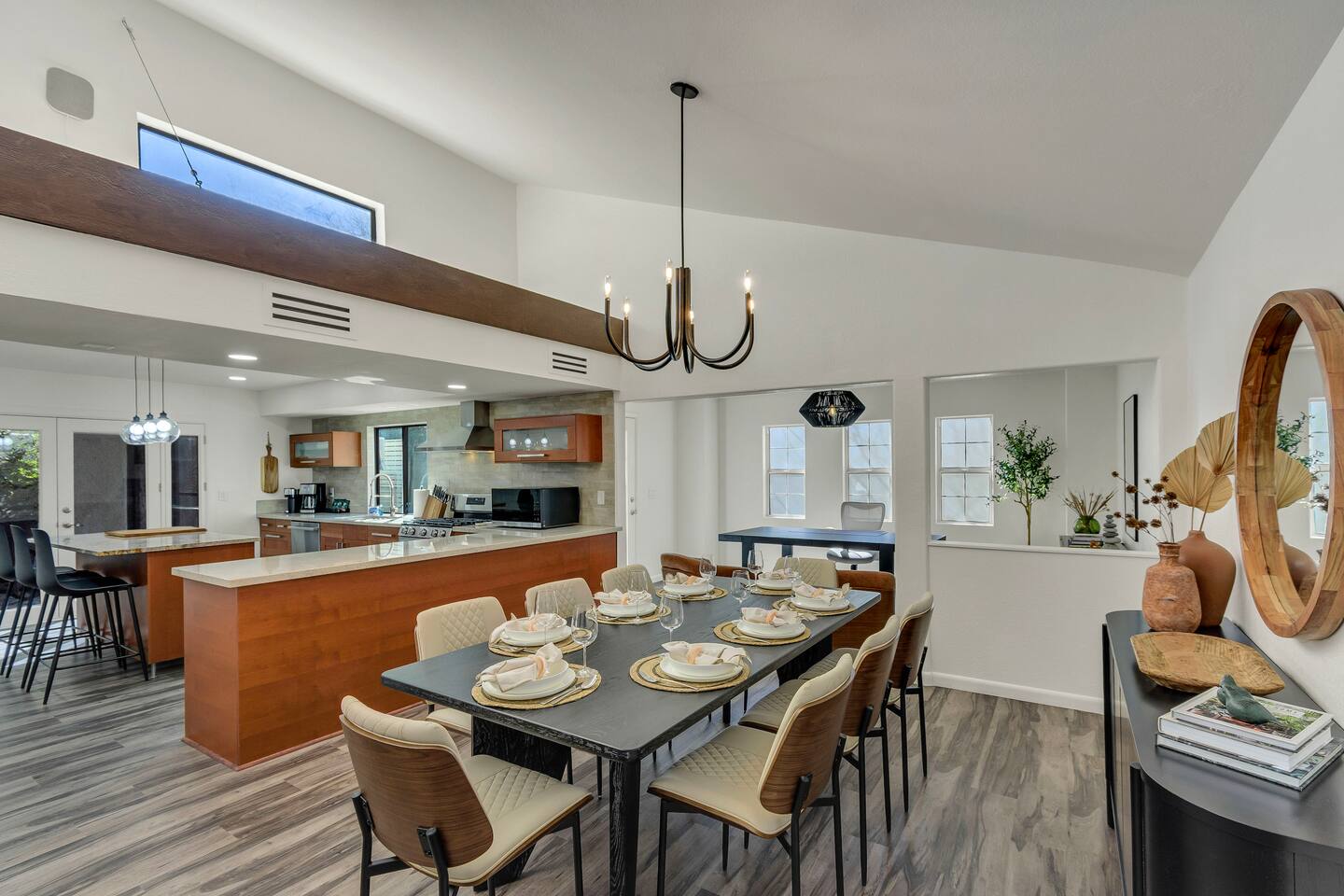 Main dining area, open to the kitchen, which also has 3 stool for in-kitchen dining.