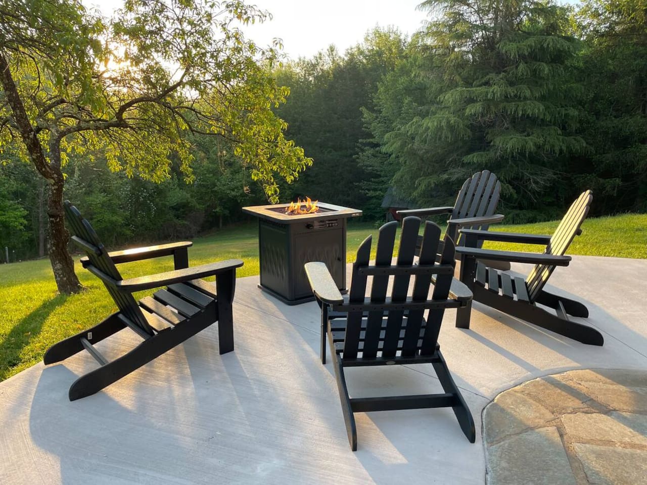 Outdoor seating surrounding the fire pit is shared with any other guests staying in the private suites.