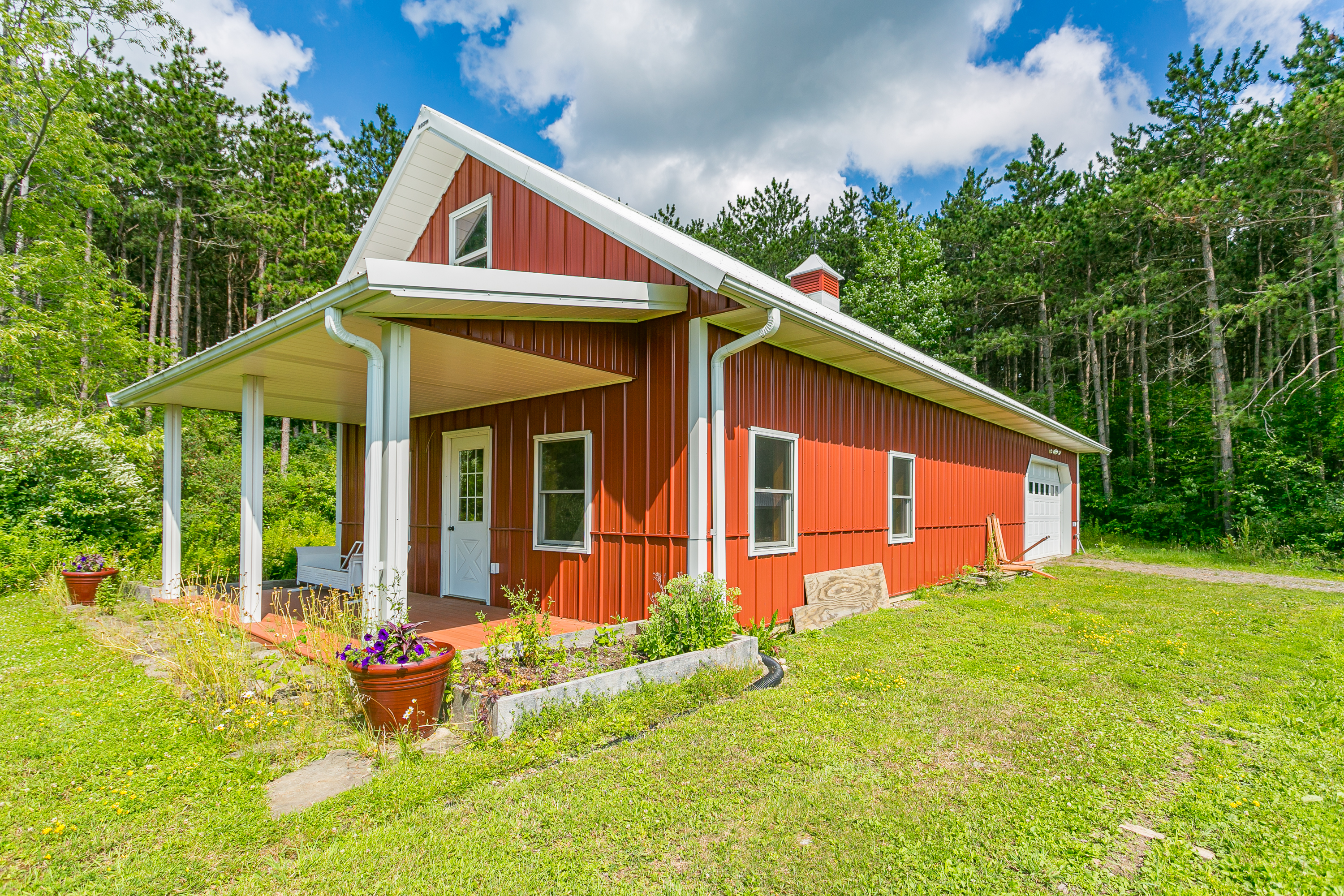 Inviting yoga studio/gym with a welcoming covered porch.