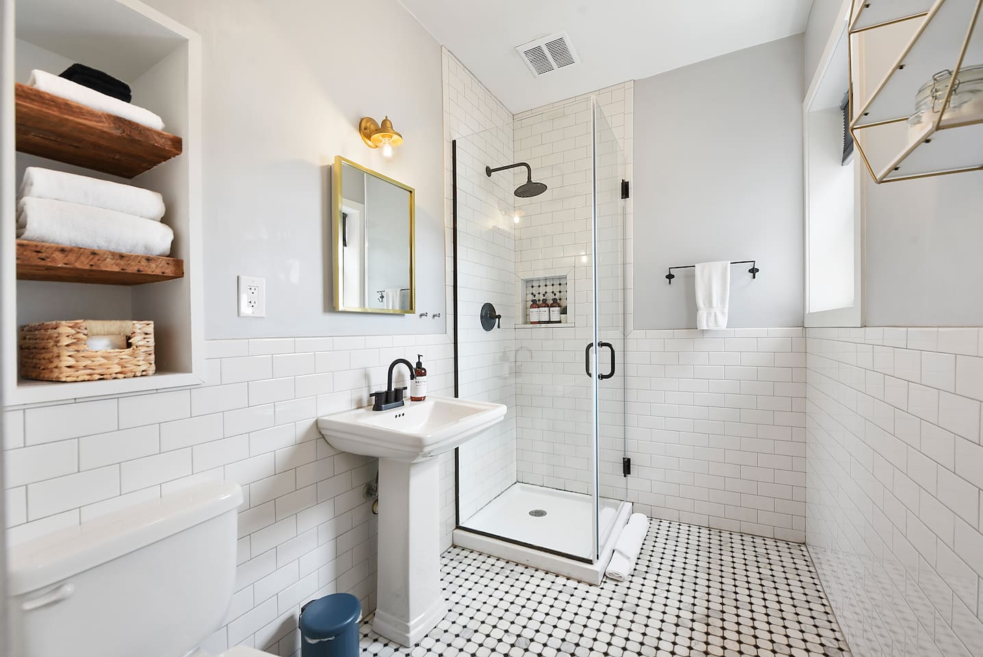 Sparkling all-white full bathroom featuring a sleek walk-in shower for a fresh, modern touch.