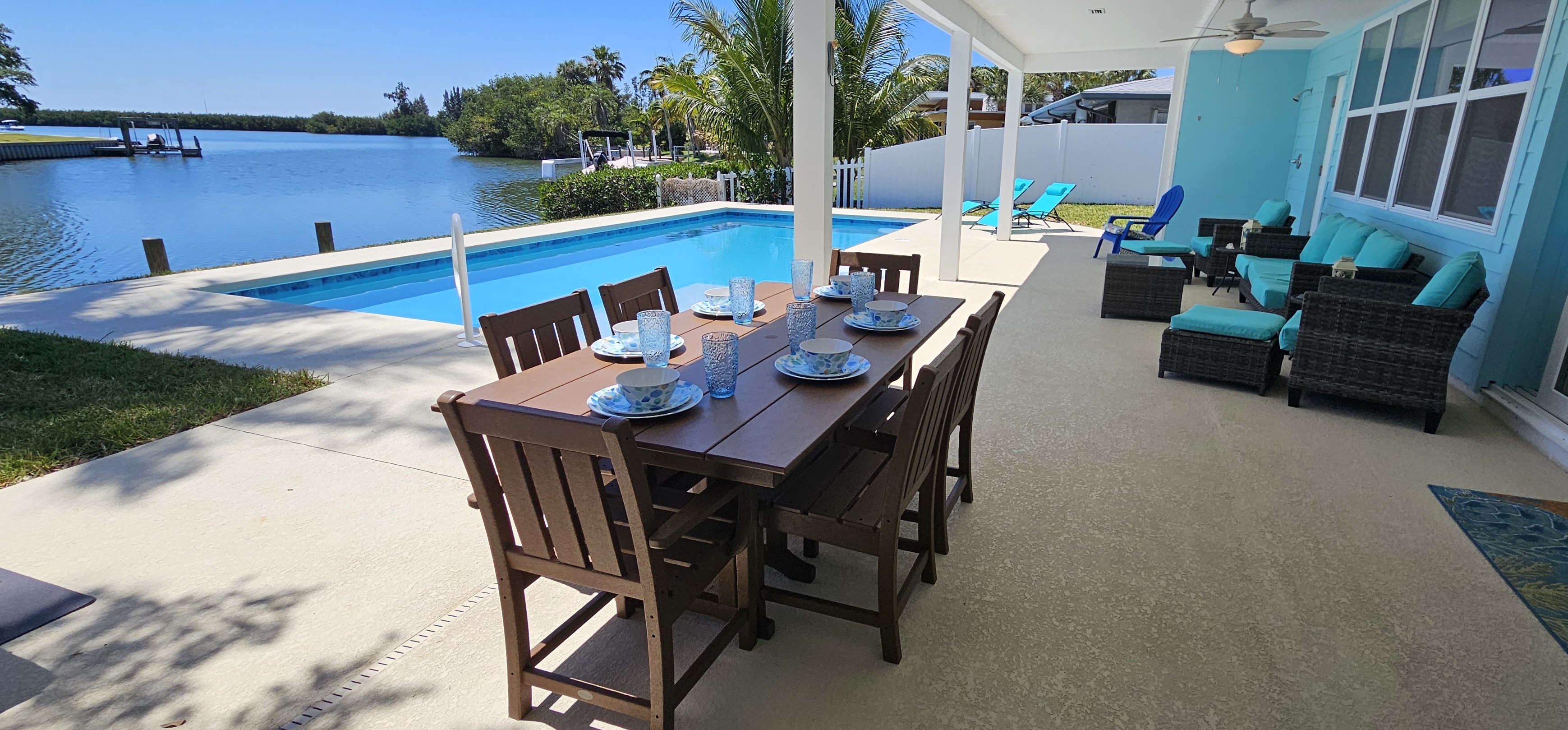 Enjoy the canal and river views while dining beside the pool