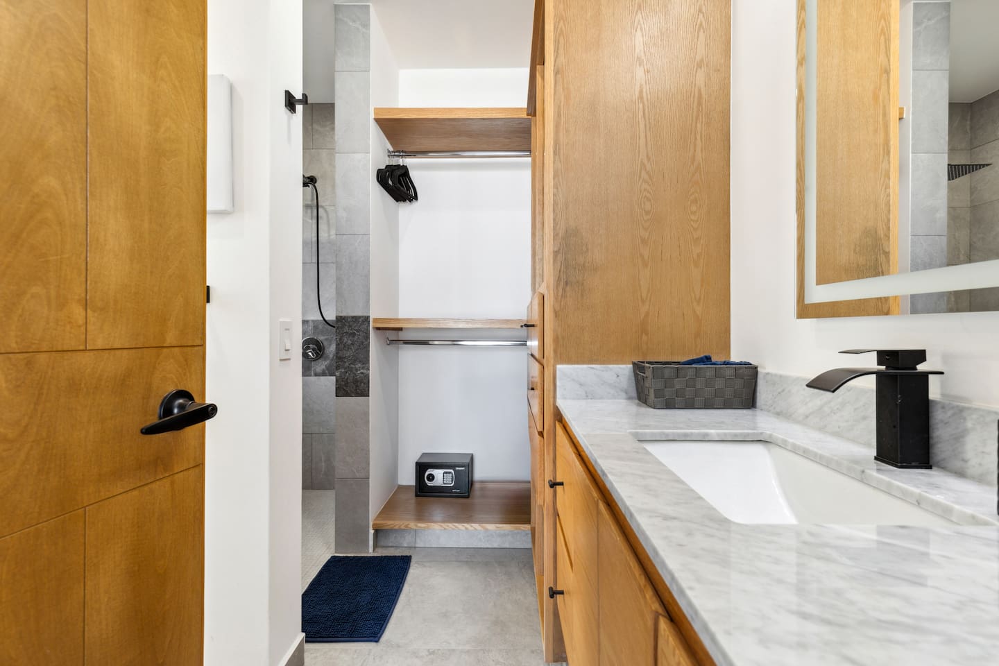 Discover the master bed bath with ample storage and convenient racks for hanging clothes, featuring an air purifier in the closet for a fresh, clean environment.