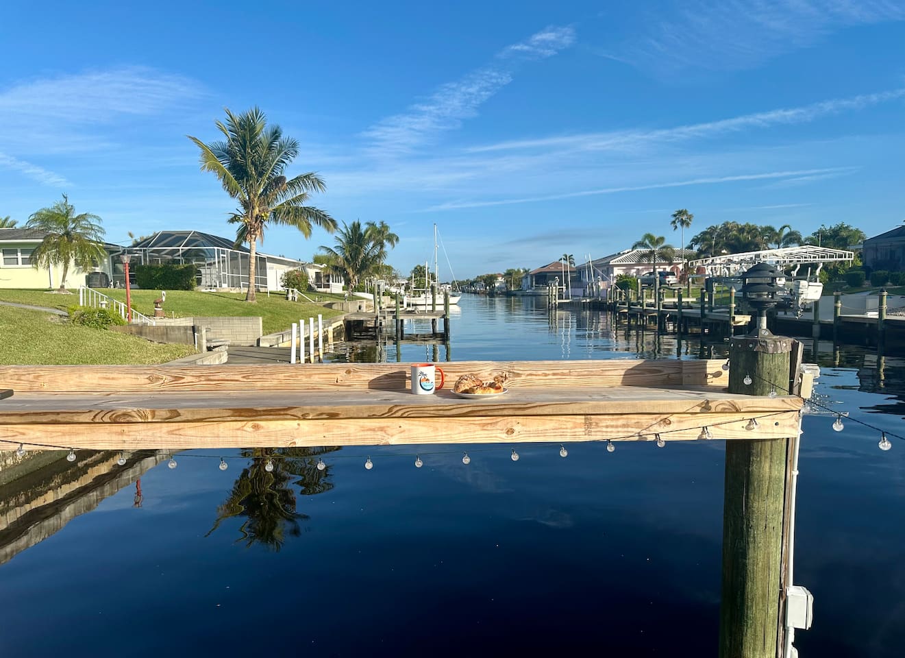 Dock table is perfect for a morning cup of coffee and a croissant from a local bakery