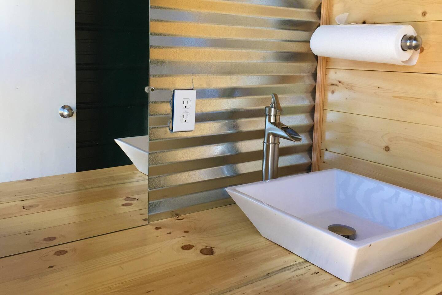 The Glamping cabins, Tipi, and Western Wagon all share the two bathrooms located at the pavilion. Each bathroom has a hot water shower.