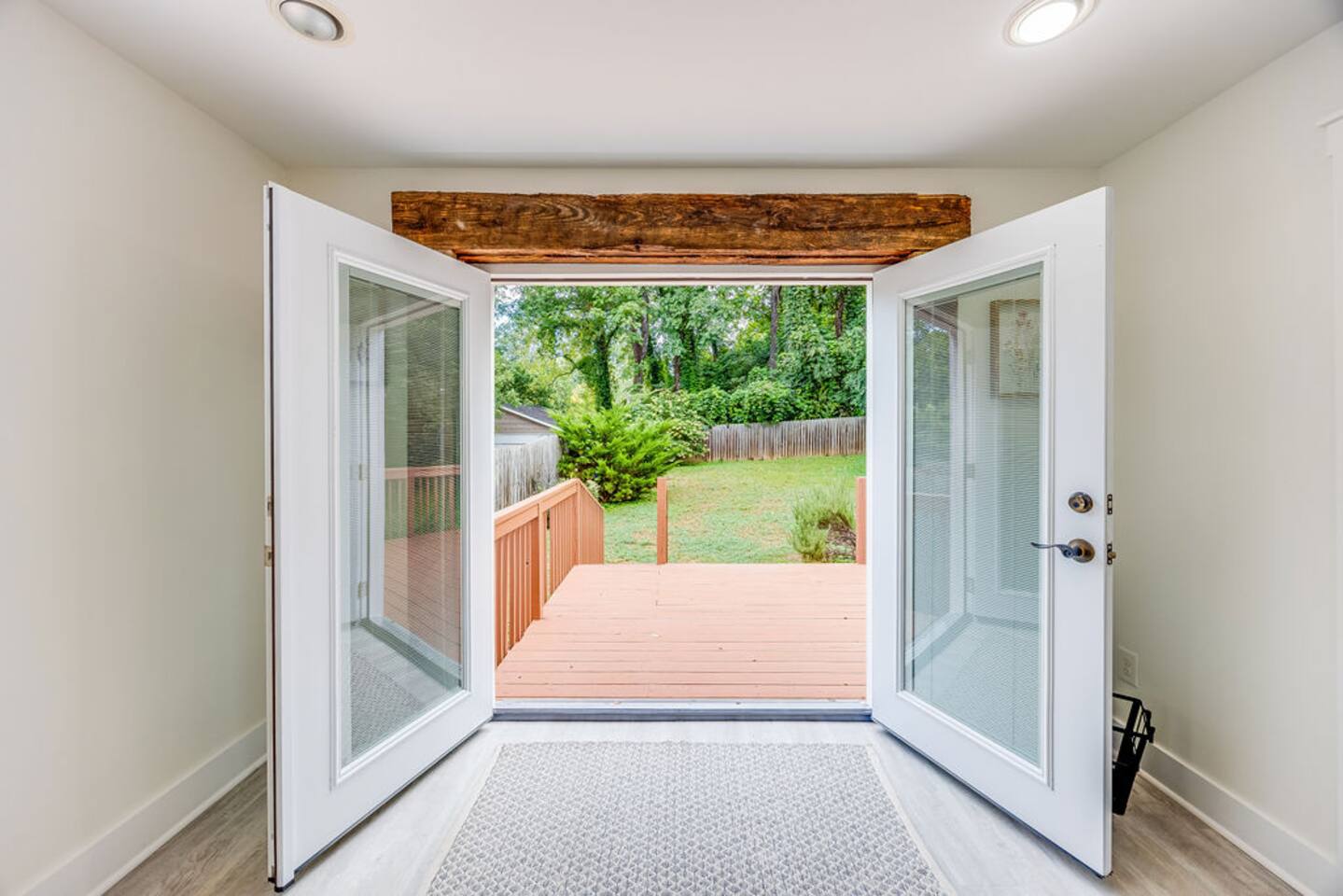 Door leading to the backyard, offering easy access to outdoor space for relaxation and exploration.