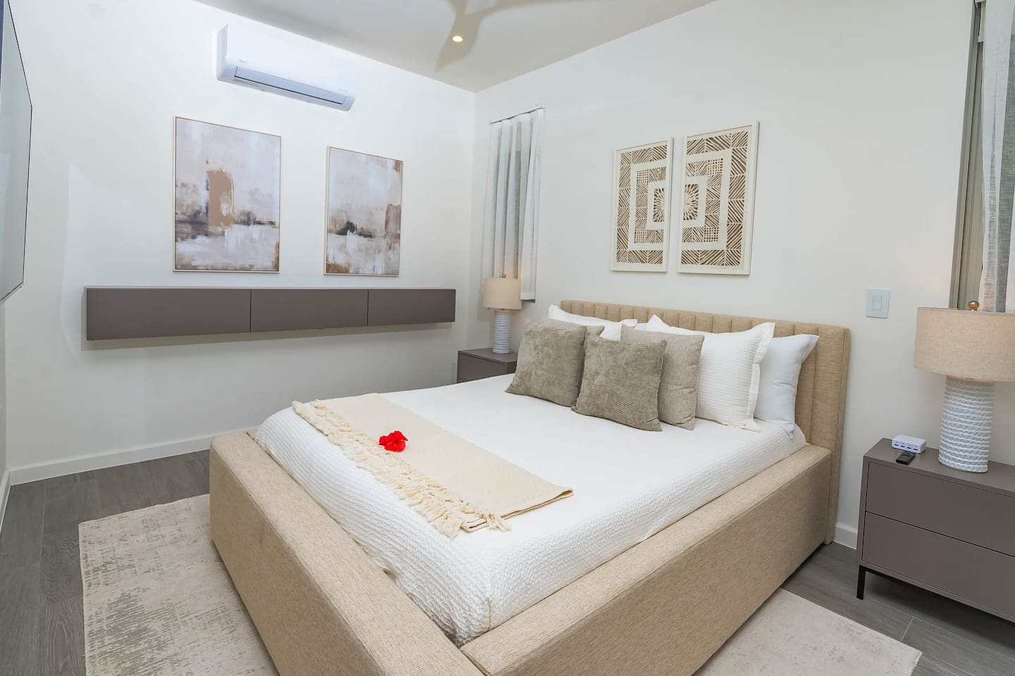 2nd bedroom with queen size bed, air conditioning, ceiling fan, wall mounted TV and closet.