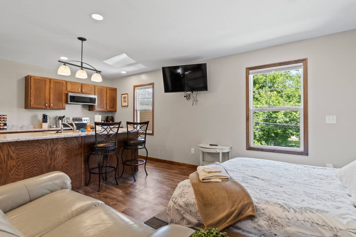 Bedroom with easy access to the living area and kitchen, creating a convenient and open layout for seamless movement throughout the space.