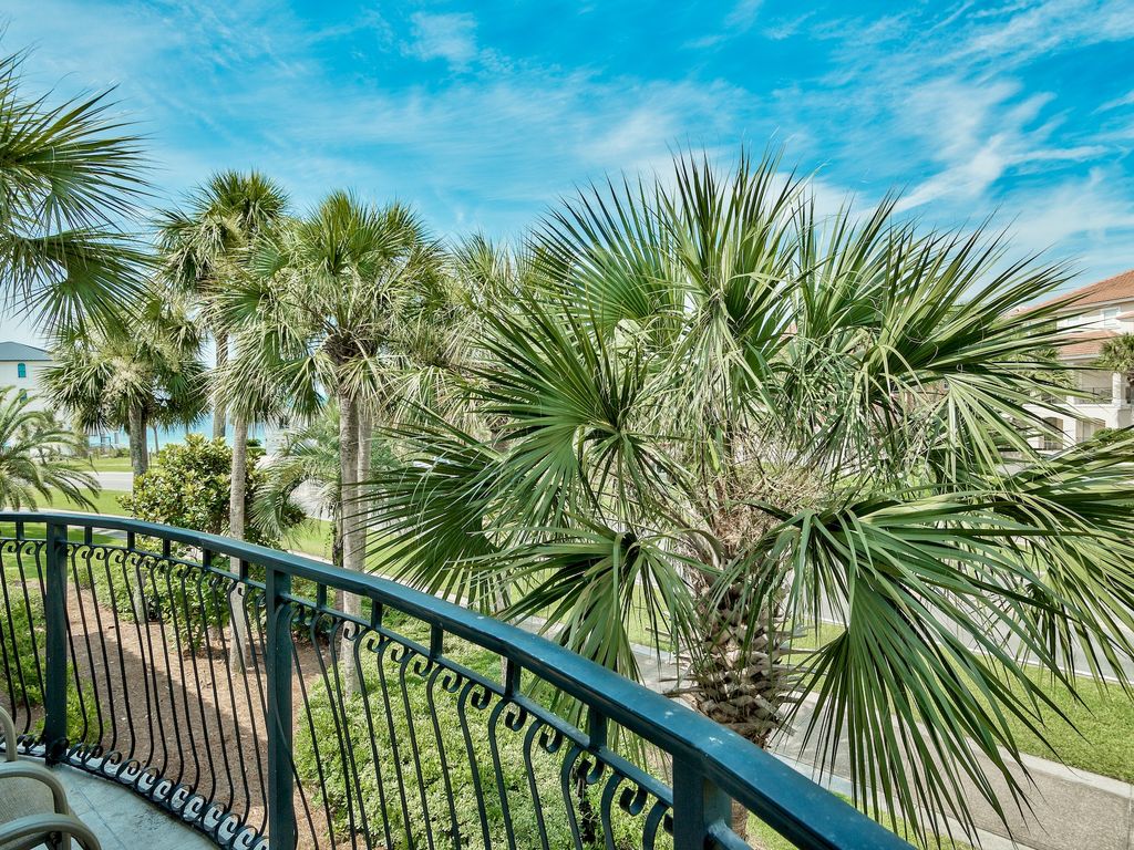 Primary suite with private side balcony and Gulf views