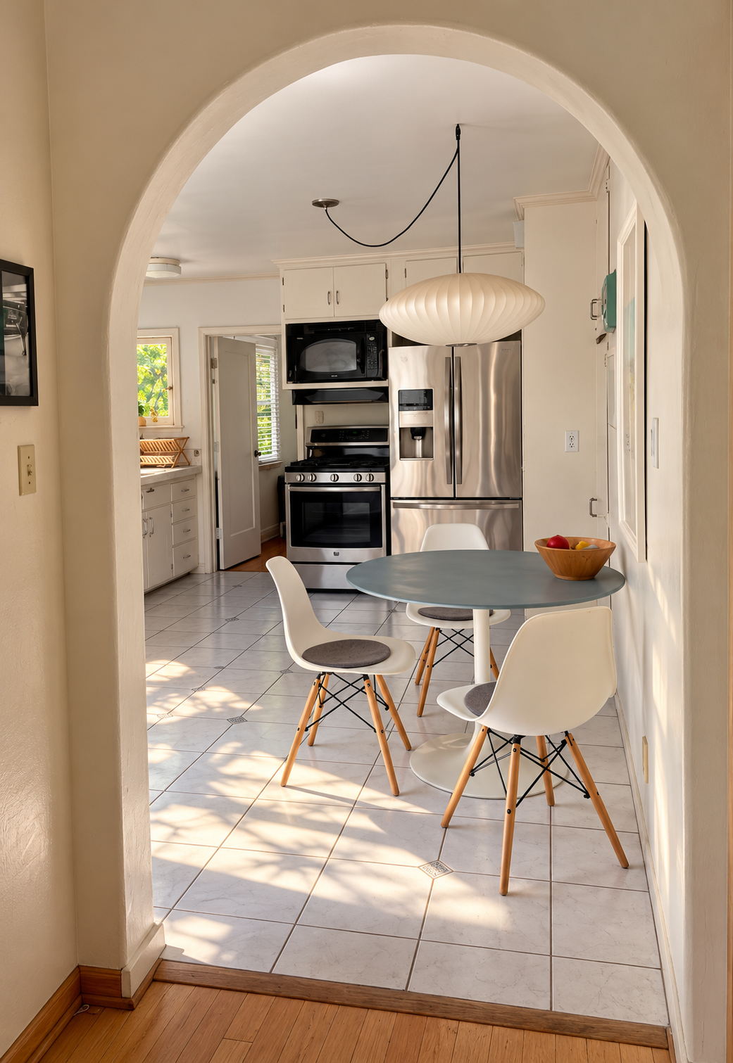 Arched doorway into the kitchen and breakfast nook.