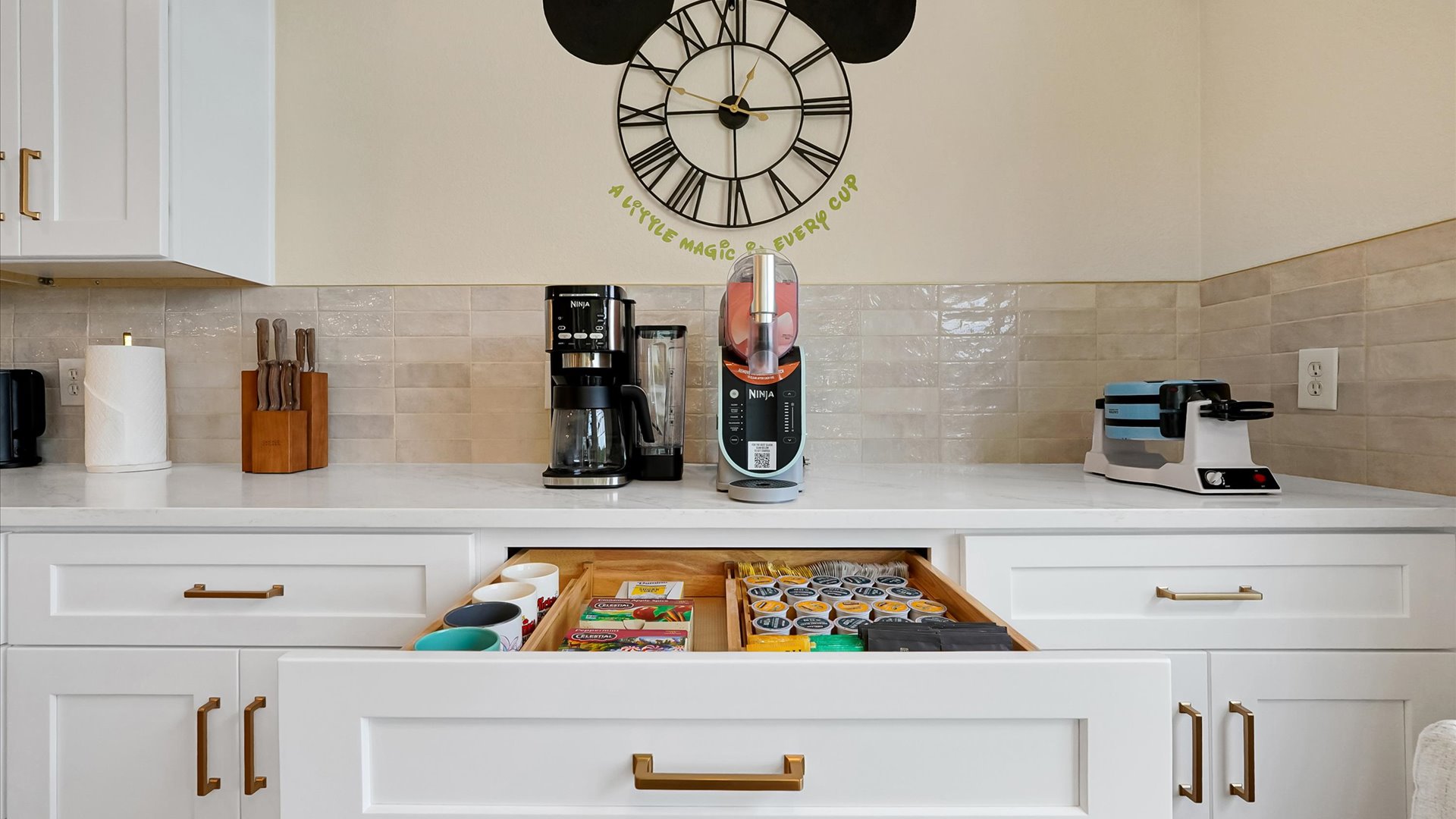 Coffee Bar: Dedicated coffee station with a Ninja coffee maker, frozen-drink machine, waffle maker and a selection of coffee and tea.