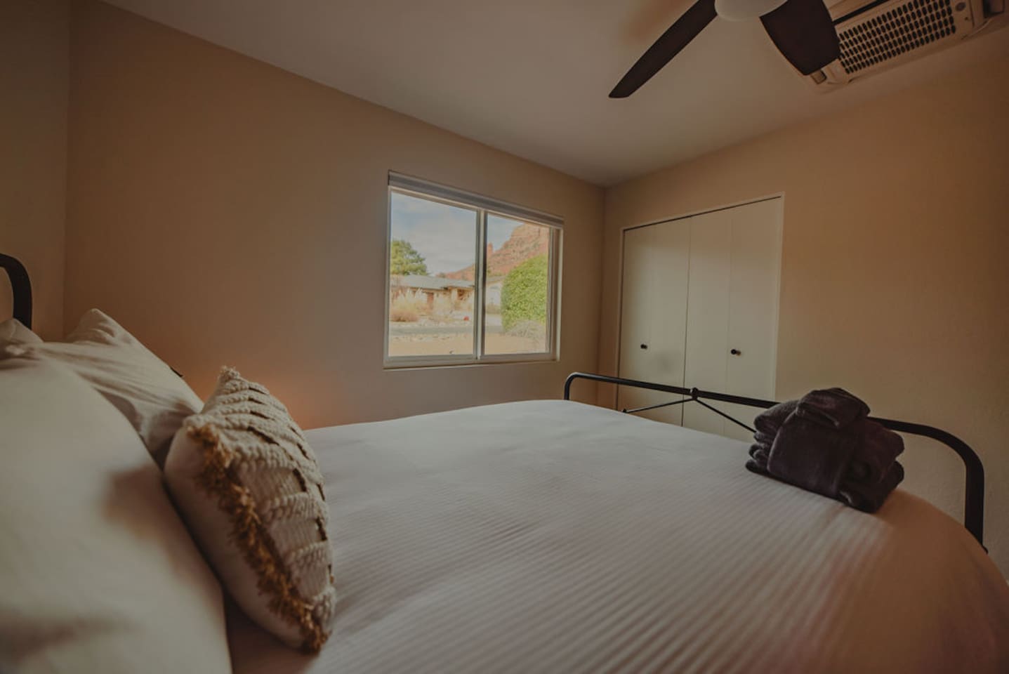 Soft linens and cozy touches for a restful night’s sleep