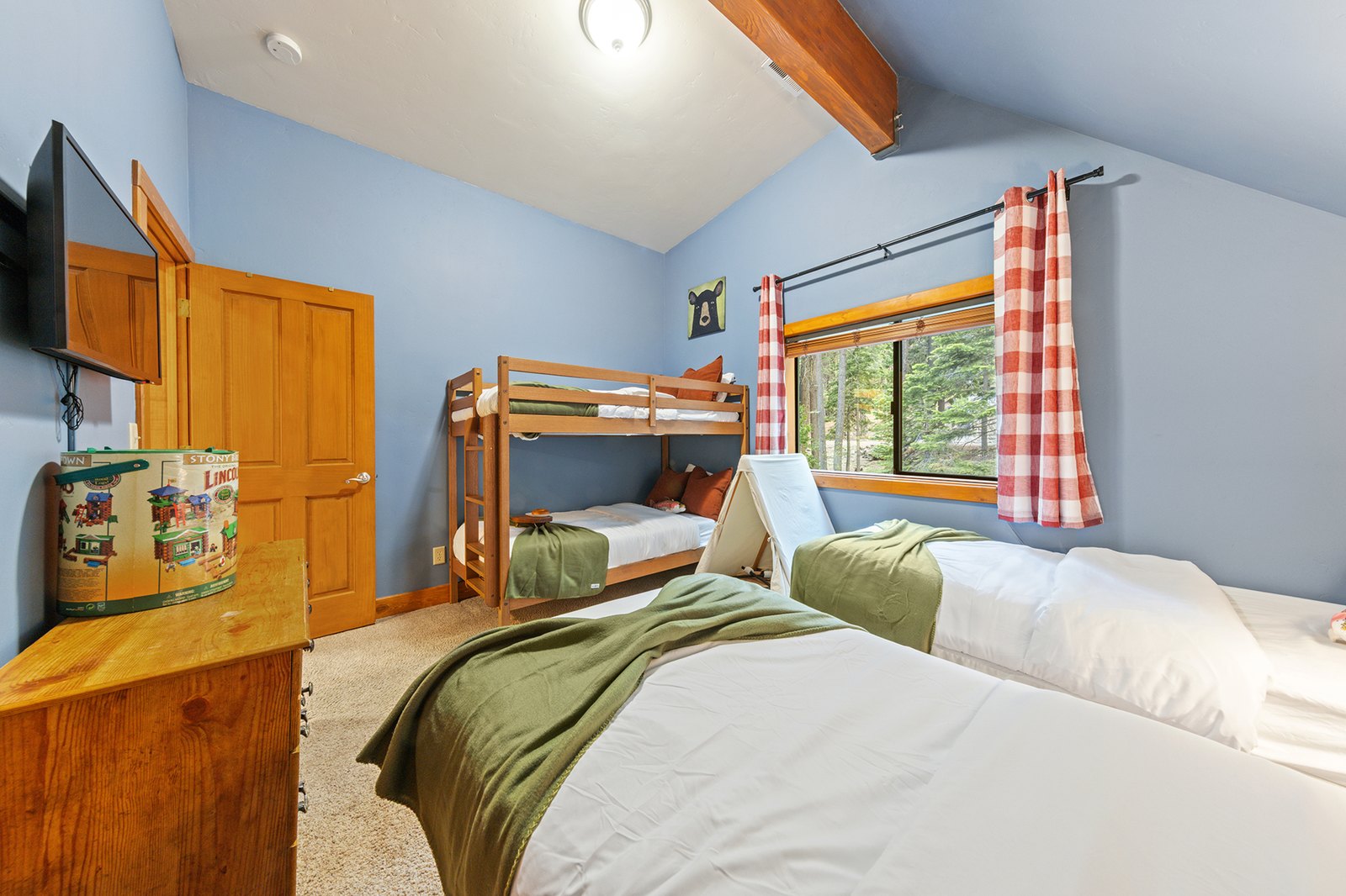 Stock the kids up for the evening — a TV of their own, Lincoln Logs on the dresser, and bunks to argue over.