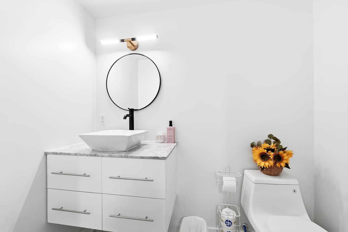 Sweet modern half bathroom located in the basement by the entertainment area. 