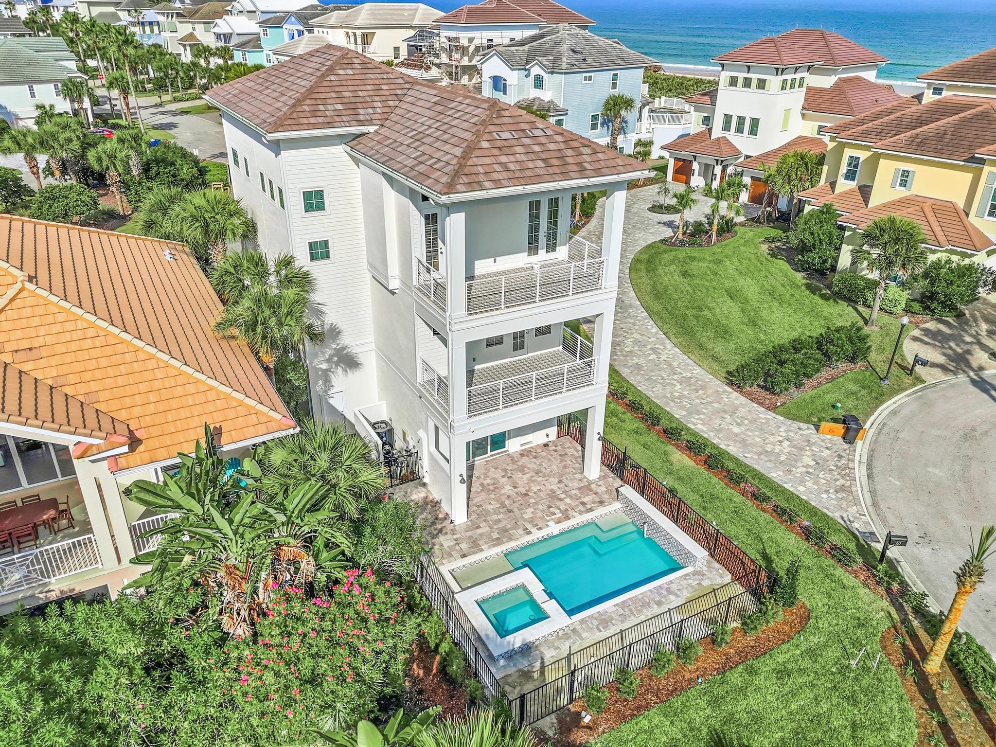 A quiet cul-de-sac, the ocean at the end of the lane, and your own heated pool waiting back home. Beach mornings, pool afternoons, spa nights—repeat until the kids beg to stay one more day.
