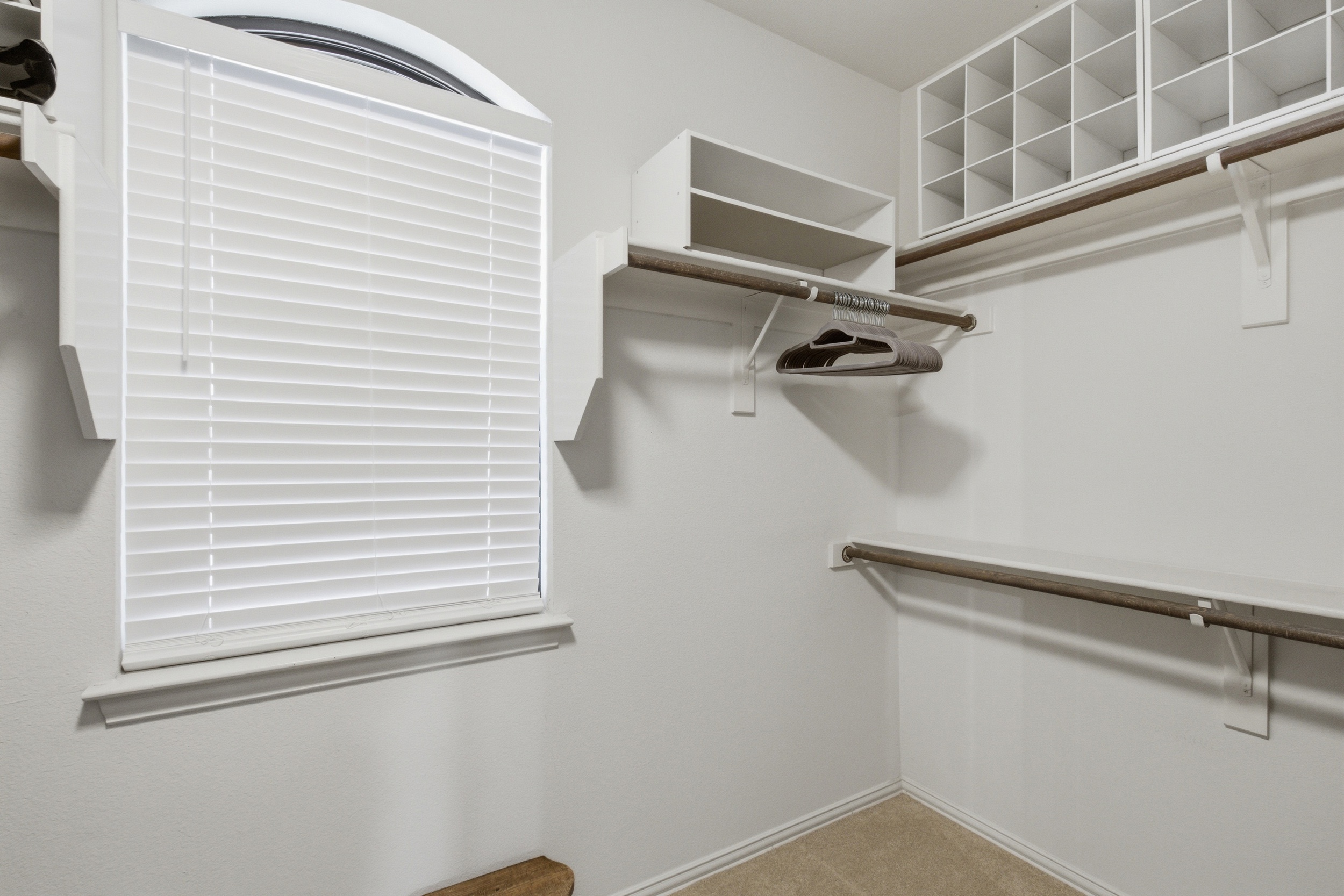 Walk-in Master Closet with hanging space, shelving, and storage. The Pack n Play is stored inside for traveling families.
