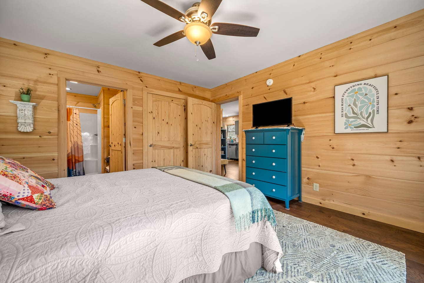 Bedroom #1 of the cabin with queen bed and en suite full bathroom