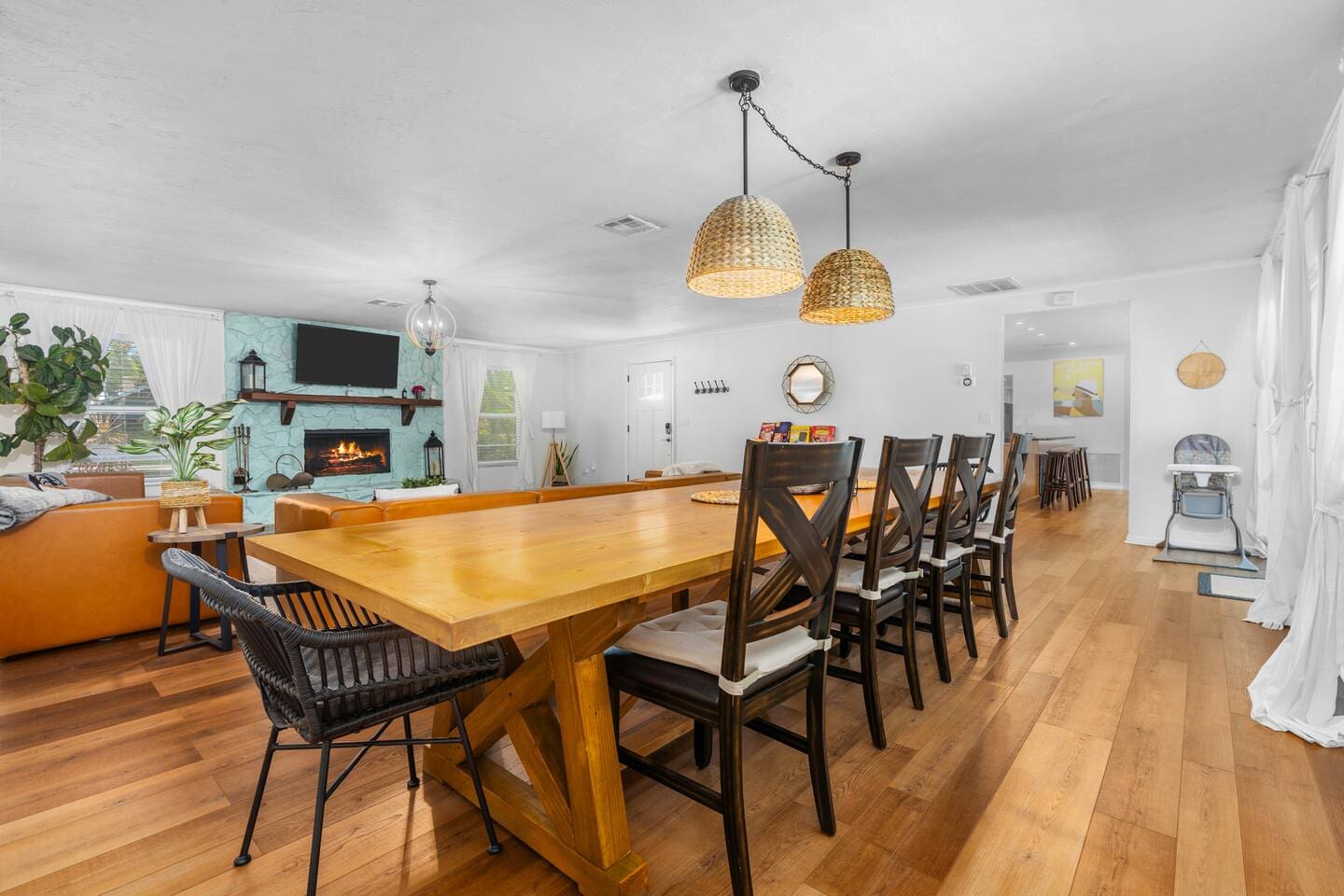 Newly decorated! Huge boho themed living room with 12-foot long custom dining table.
