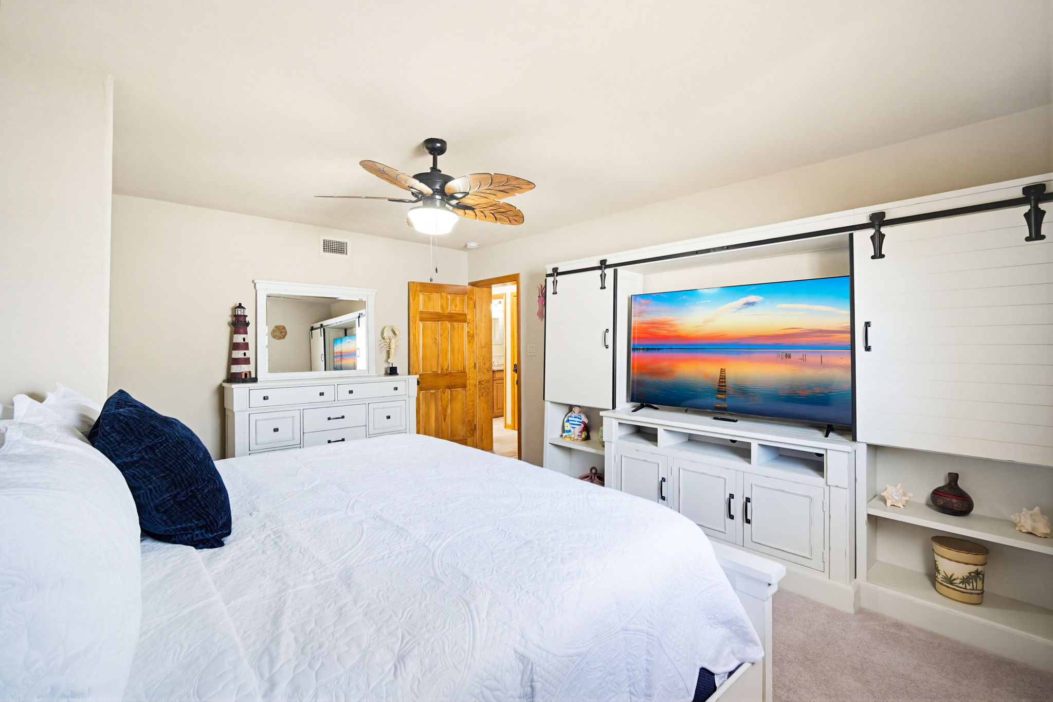A third bedroom, with a King Bed and 65 inch TV.