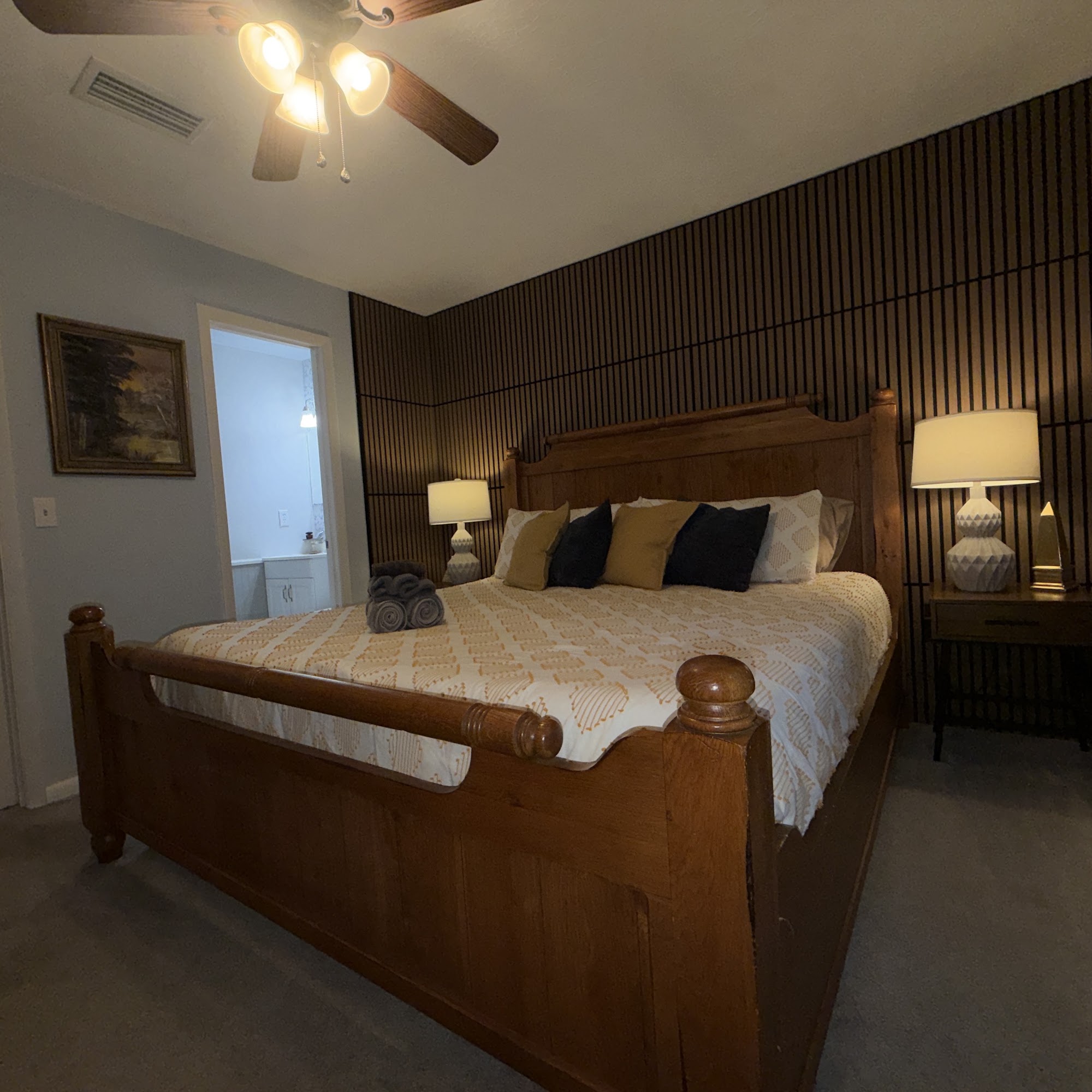Bedroom 1: king bed with en-suite half bath