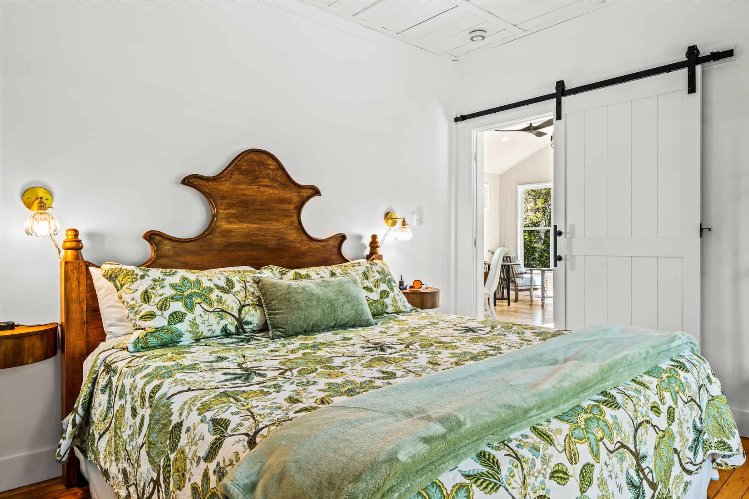 The bedroom retains its rustic cottage charm while providing guest comfort.