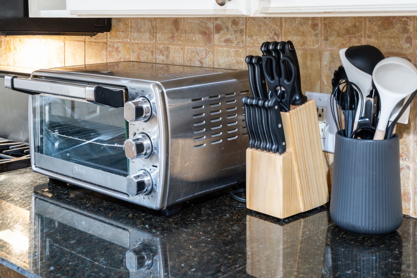 Fully stocked with essential kitchen tools, a quality knife set, and a countertop oven — cook like you're at home.