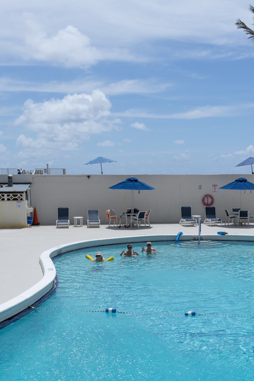 Your backyard. Heated pool, lounge chairs, and blue skies — 30 seconds from your front door.