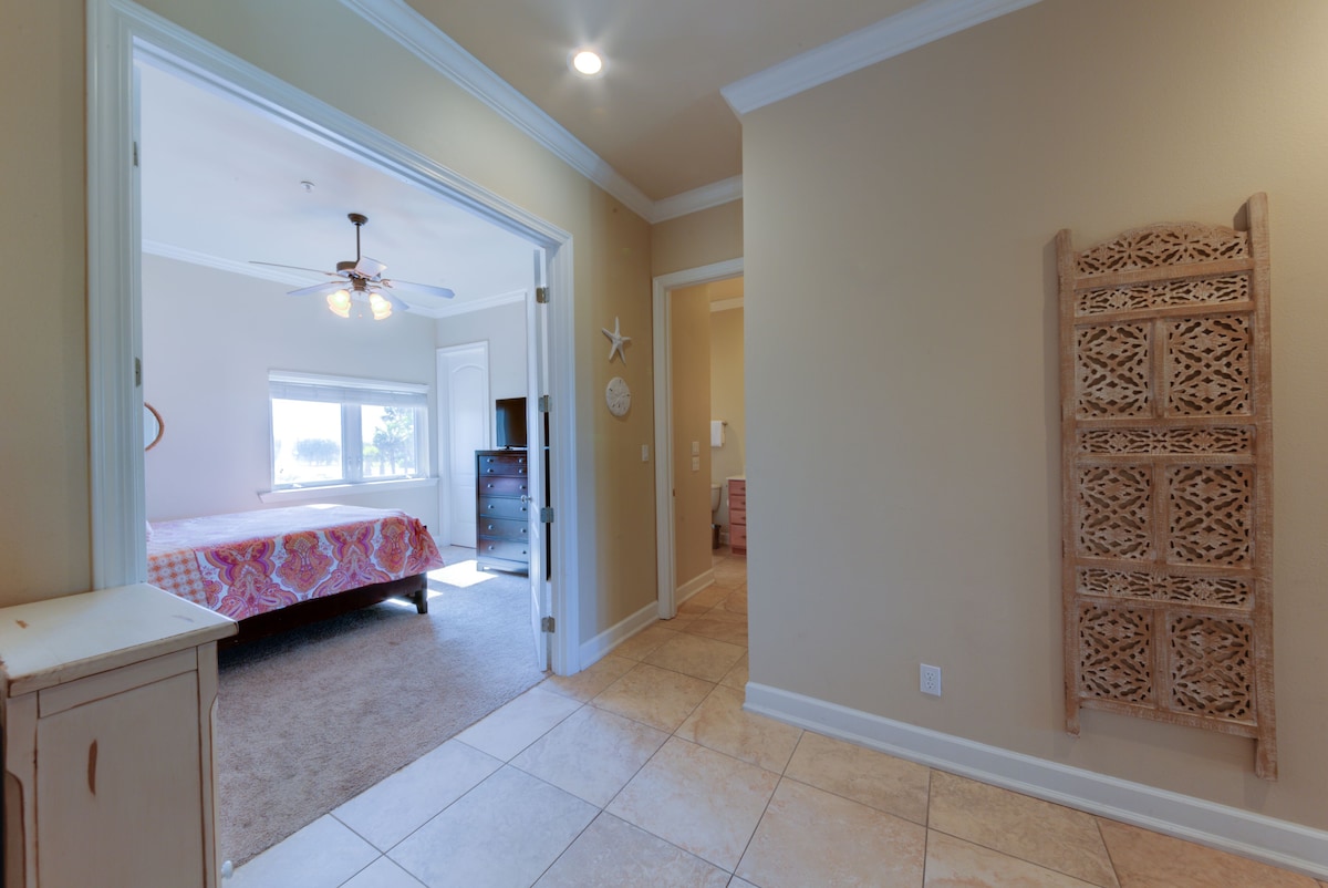 Entry hall. View of queen room and first floor full bath.