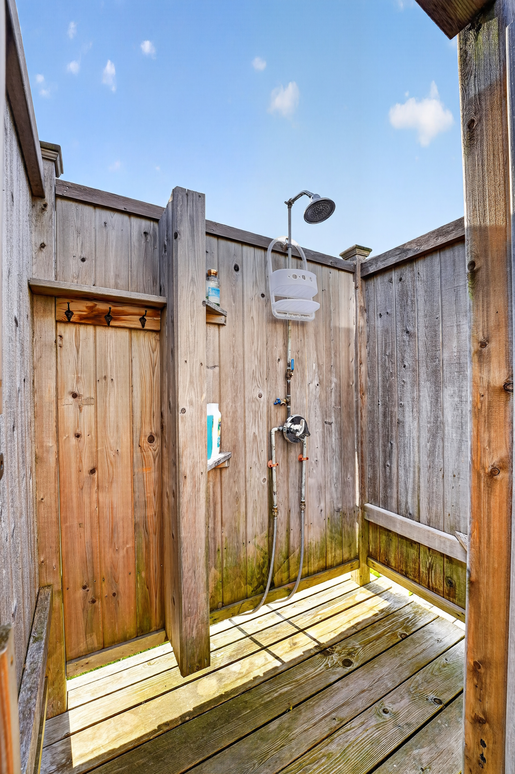 Convenient outdoor shower with hot and cold water for an easy post-beach rinse.