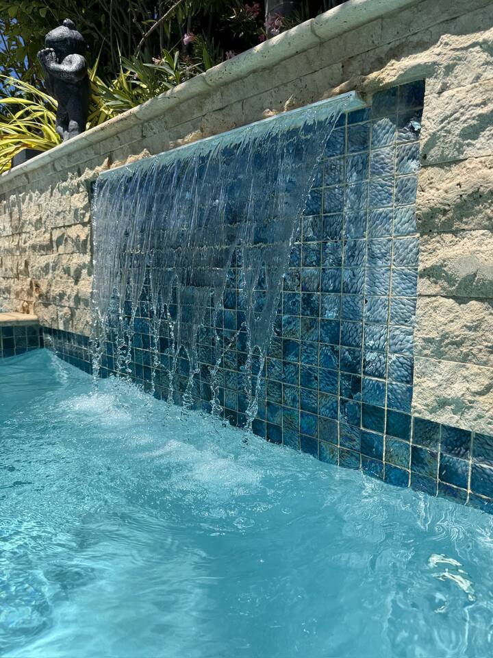 Waterfall feature in pool provides a nice water soundscape!