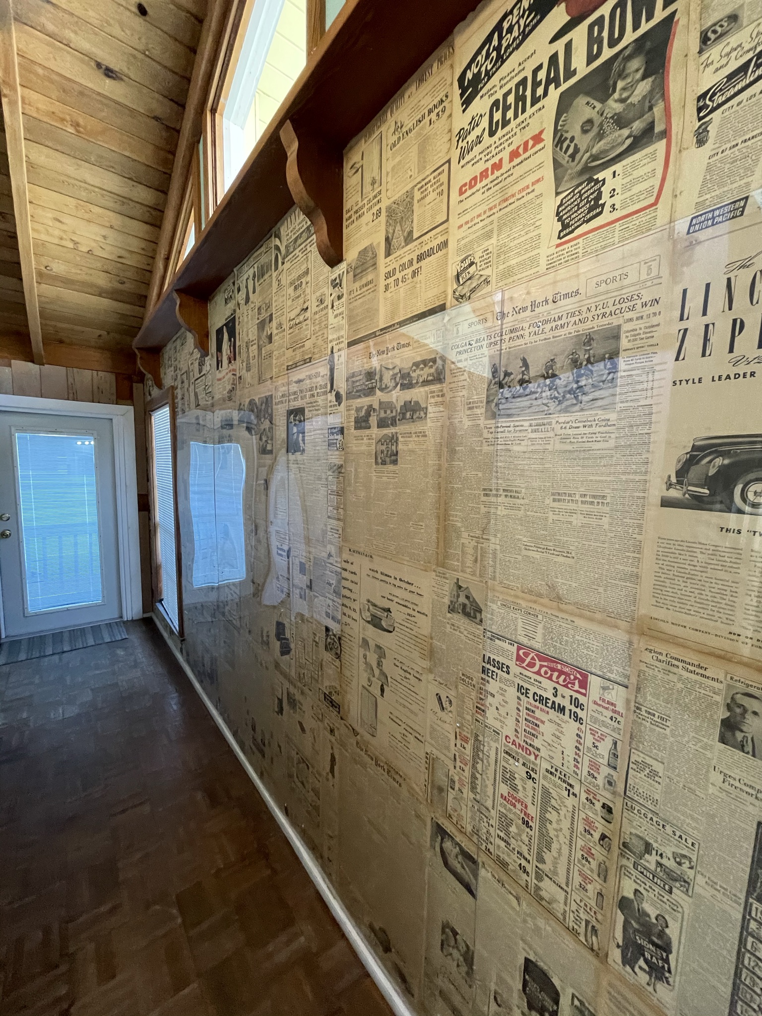 Wall of newspaper advertisements and stories from 1938 when the bungalow was built.