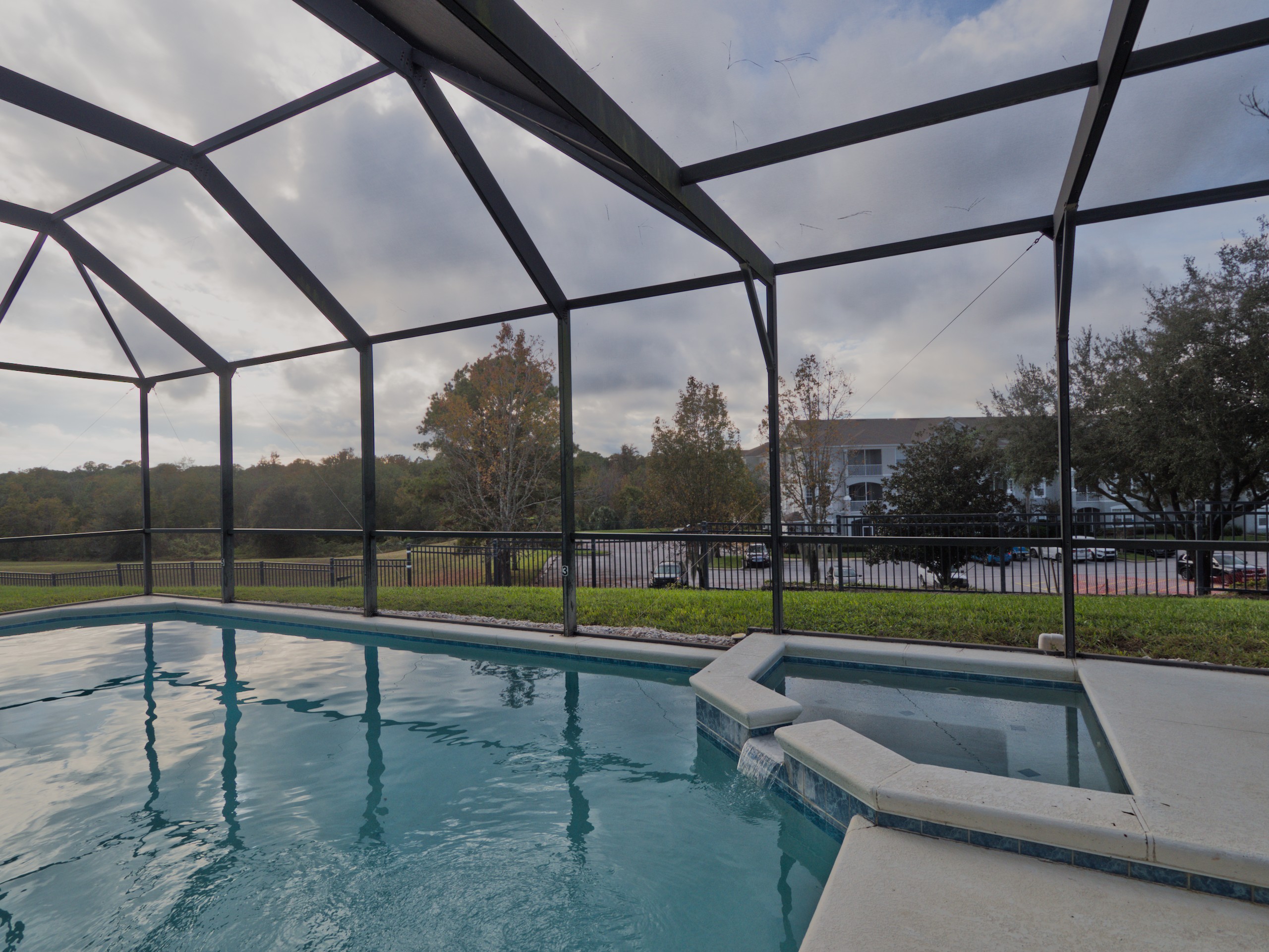 Private screened pool and jacuzzi.