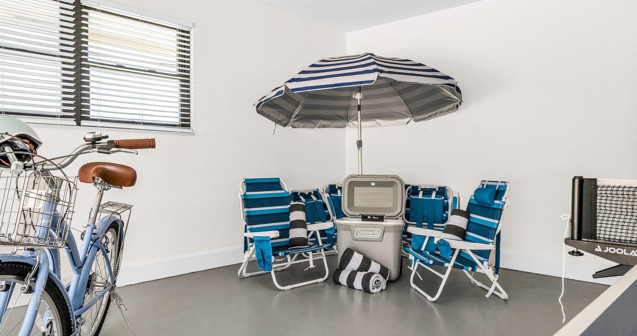 Enjoy a garage filled with extras — from a full-sized Ping Pong table, bikes, and fitness gear to beach chairs, umbrellas, towels, and a cooler — everything you need for fun at home or a perfect day by the water.
