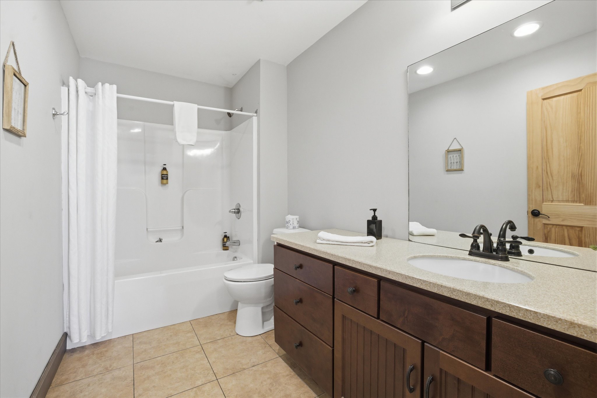 Refresh and reset in the second king bathroom, where a bright, clean layout and modern finishes make it easy to start your day or wind down at night.