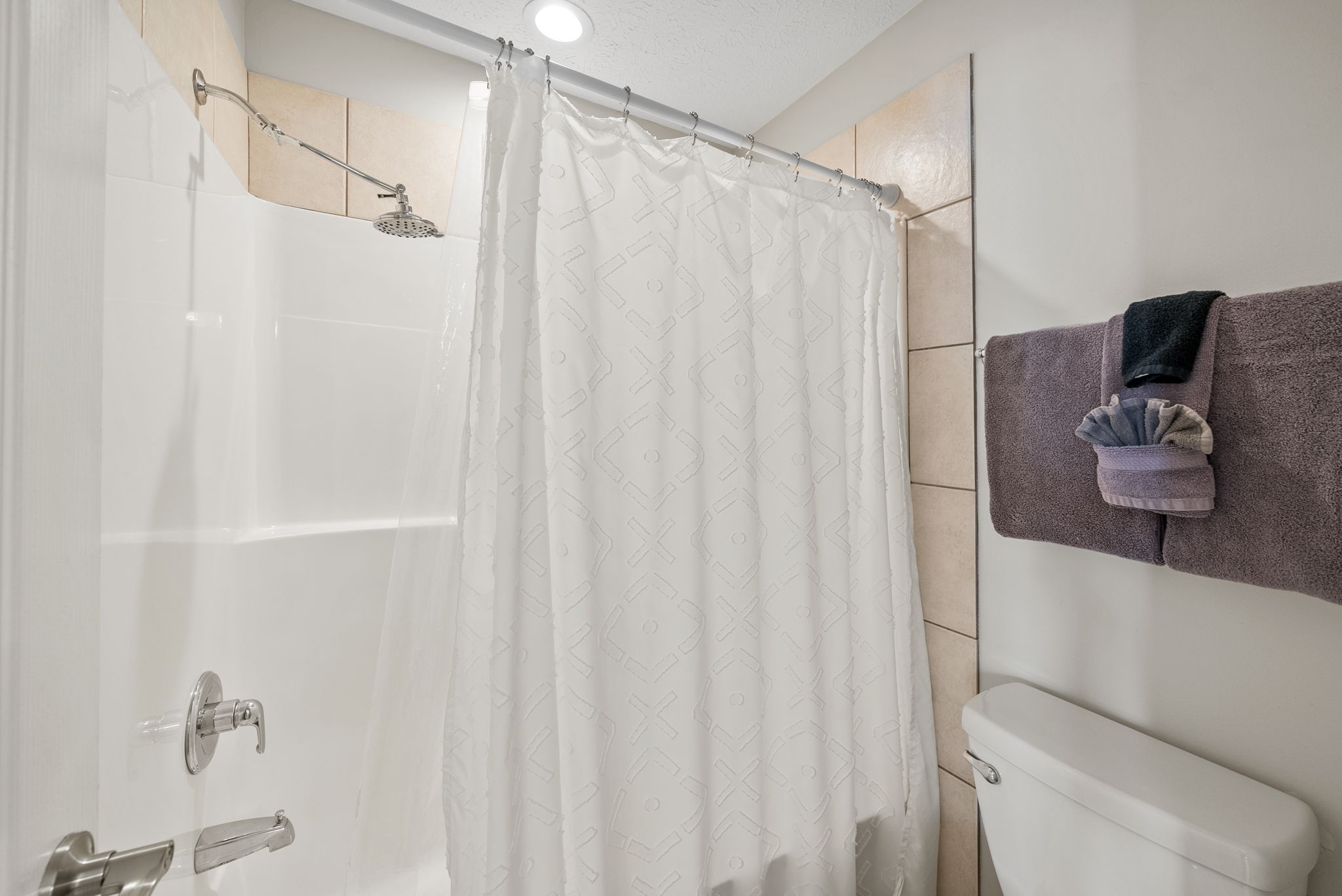 Tub/Shower combination in a separate room so some can be getting ready while another showers.