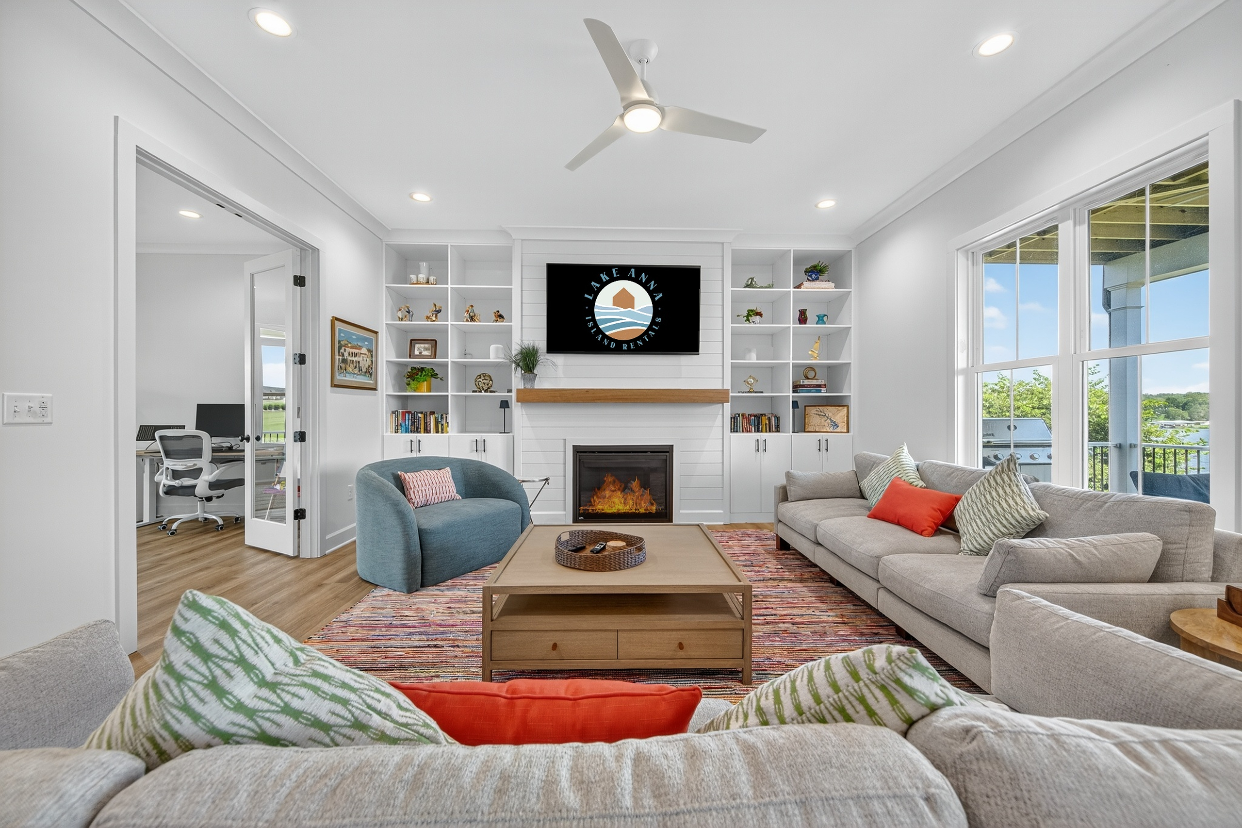 Gather and relax in the spacious living room with vaulted ceilings, comfy couches, and big windows.