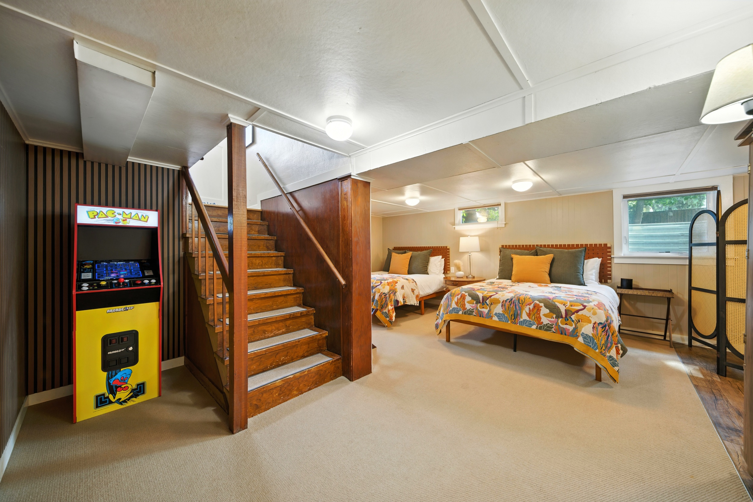Bedroom #3 of 3: open basement with 2 queen beds, Smart TV, Pac-Man and washer & dryer (not pictured)