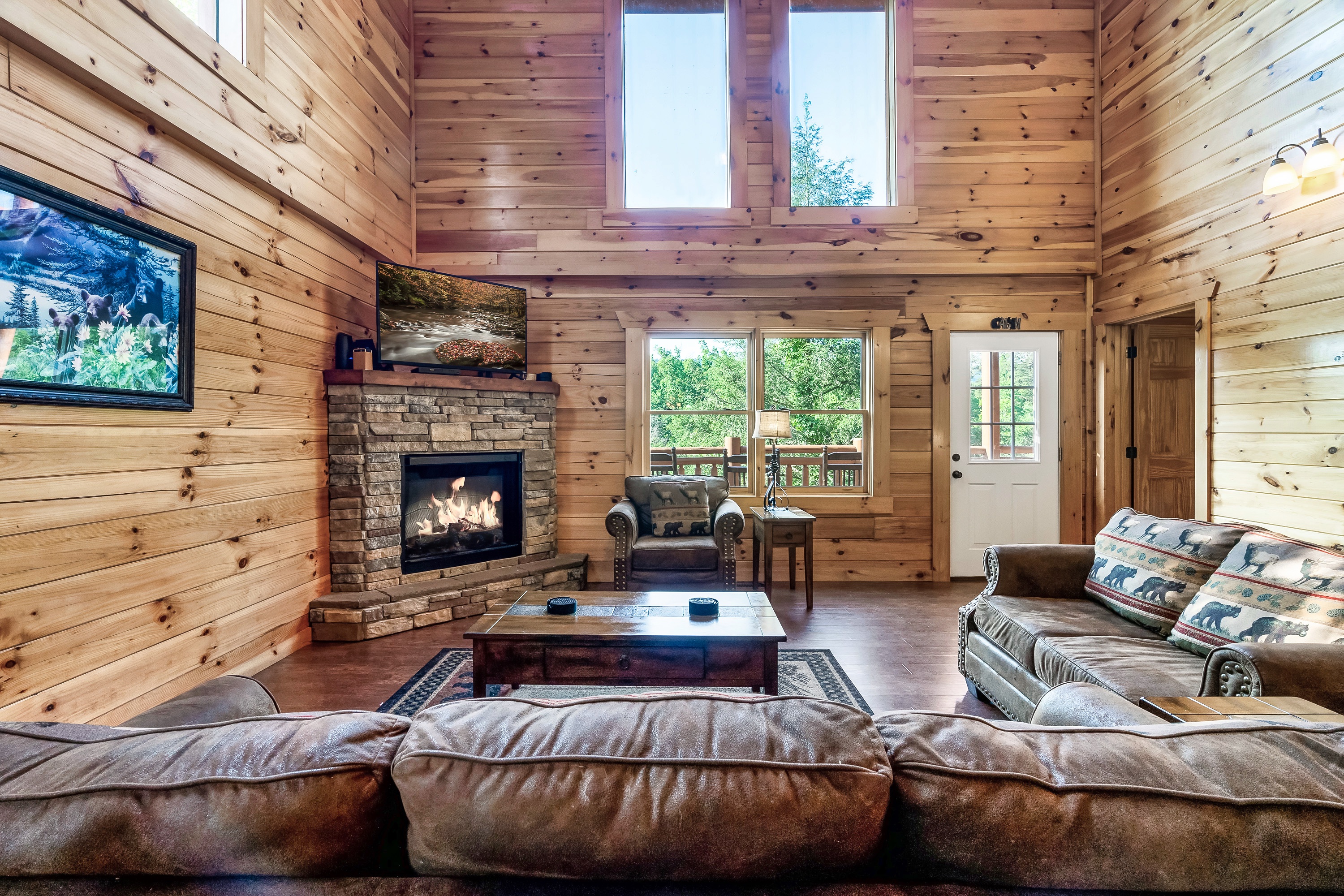 Relax together in the light filled living room where vaulted ceilings, warm wood, and mountain charm set the tone.