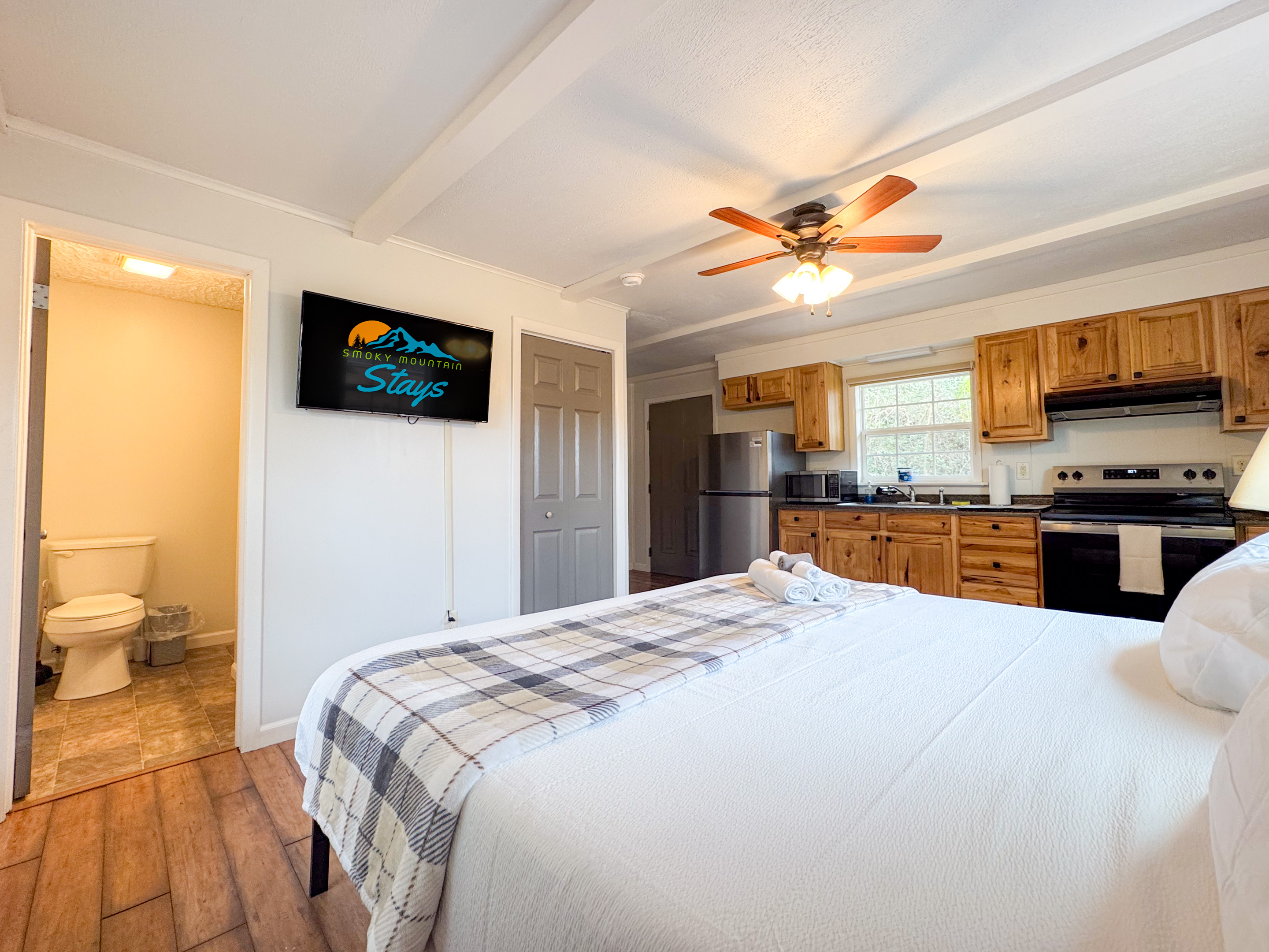 The separate apartment suite features a comfy King size bed with cooling memory foam gel and high thread count bedding. There is a smart TV, a small ensuite bathroom, refrigerator, coffee maker, and some kitchen items. Mostly for drinks and such.