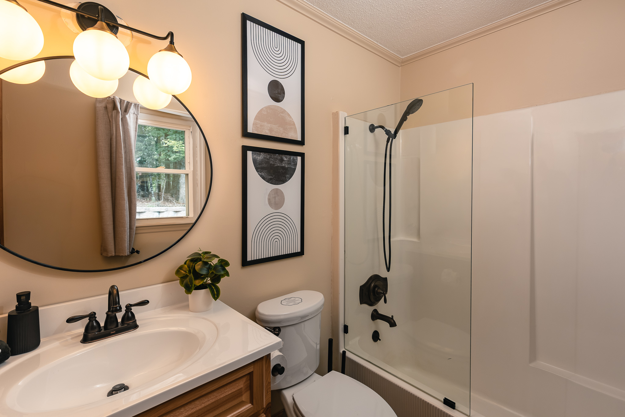 {Bathroom 2} This full bathroom features a tub and shower combination, generous vanity space, and clean modern finishes.